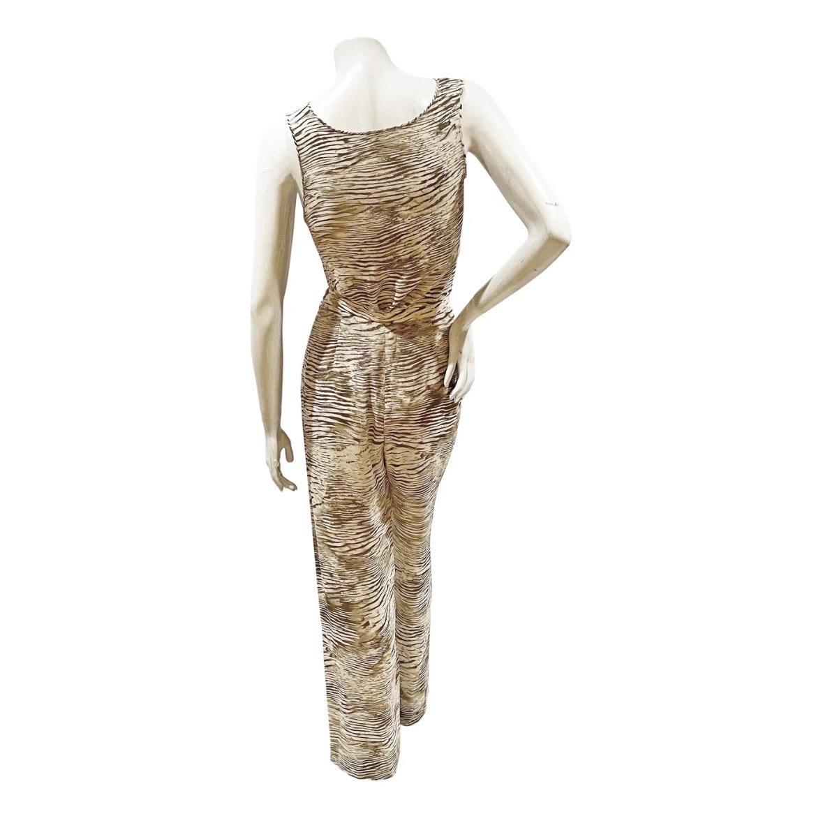 Printed Two-Piece Set by Emanuel Ungaro   
Made in Italy
Tank top and pants set
Brown wood grain print throughout both pieces
Semi-sheer  
Zipper and button side closure on pants 
100% silk 
Excellent condition; zero visible signs of