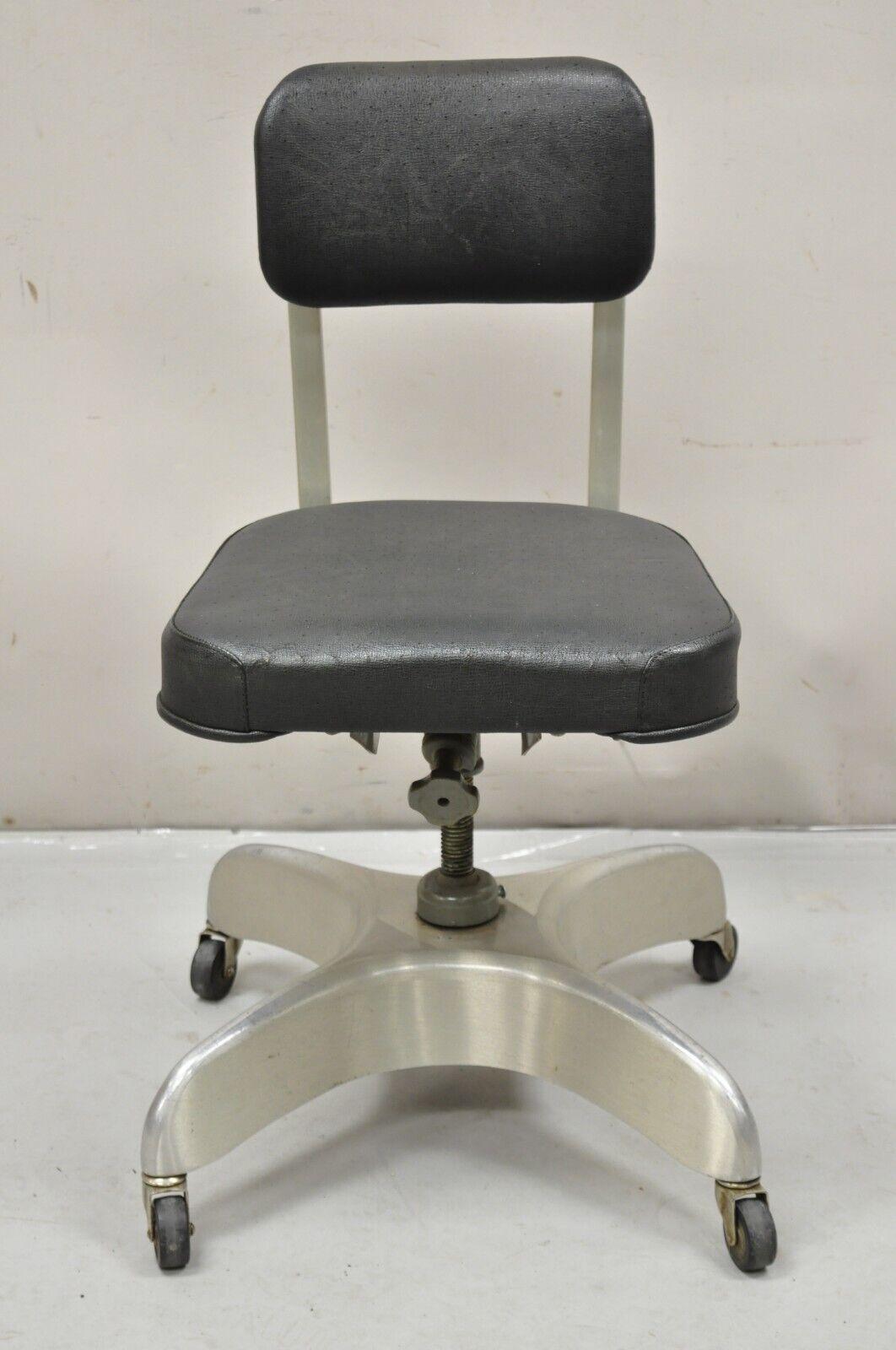 Vintage Emeco Corp Art Deco Brushed Aluminum Black Swivel Office Desk Chair. Item features an adjustable height, sculpted aluminum base, black vinyl upholstery, rolling casters, original label. Circa  Early to Mid 20th Century. Measurements: 32
