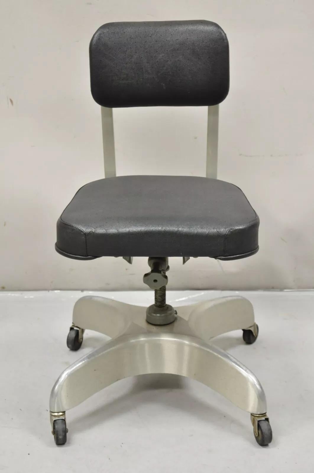 Vintage Emeco Corp Art Deco Brushed Aluminum Black Swivel Office Desk Chair. Item features an adjustable height, sculpted aluminum base, black vinyl upholstery, rolling casters, original label. Circa  Early to Mid 20th Century. Measurements: 32