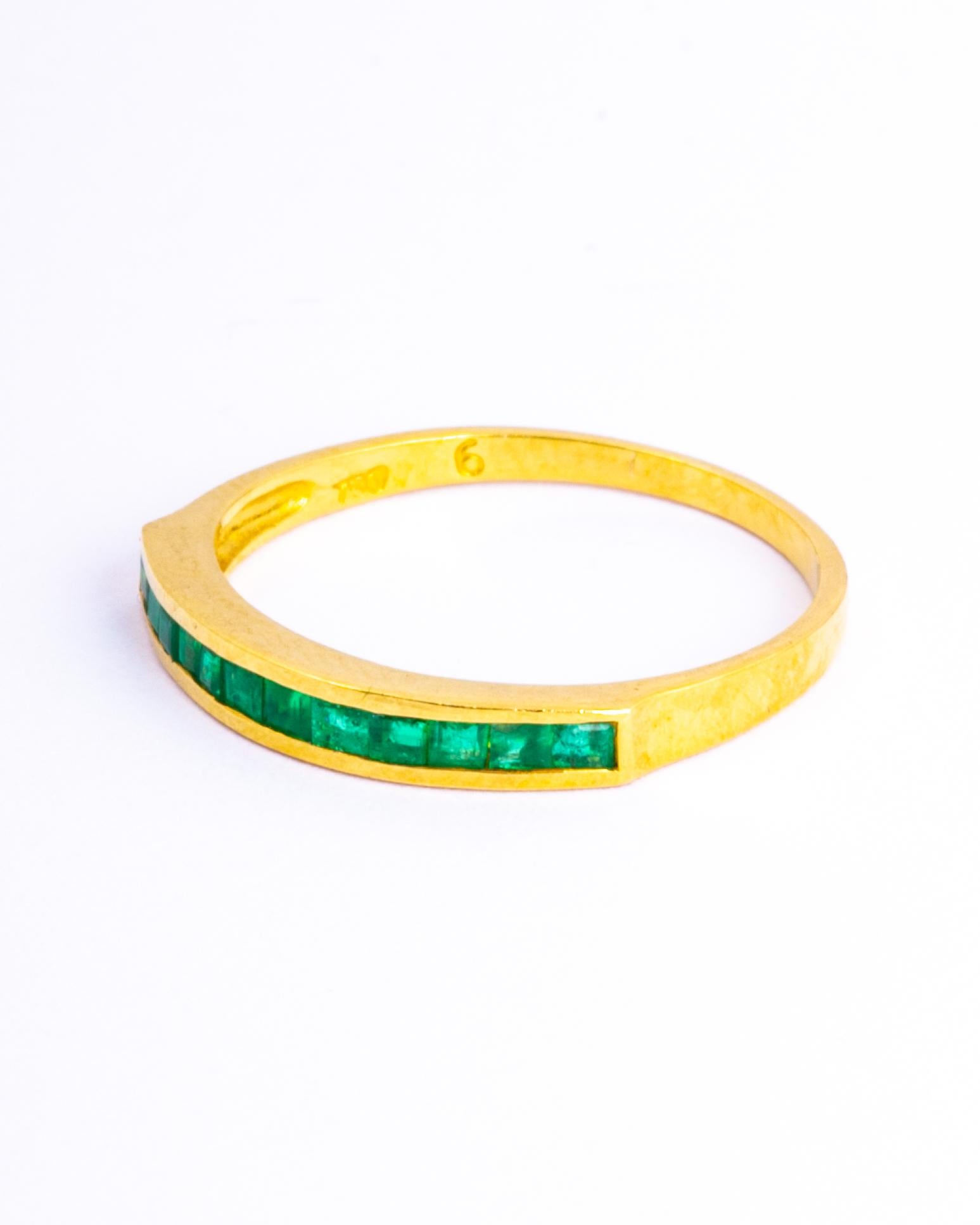 The emeralds set within this 9ct gold band are square cut and total approx 50pts. They have a great shine to them and are beautifully bright stones. 

Ring Size: M or 6 1/4 
Band Width: 2.5mm 

Weight: 2g