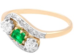 Vintage Emerald and 0.45 CT Diamond 14 CT Yellow Gold Twist Ring