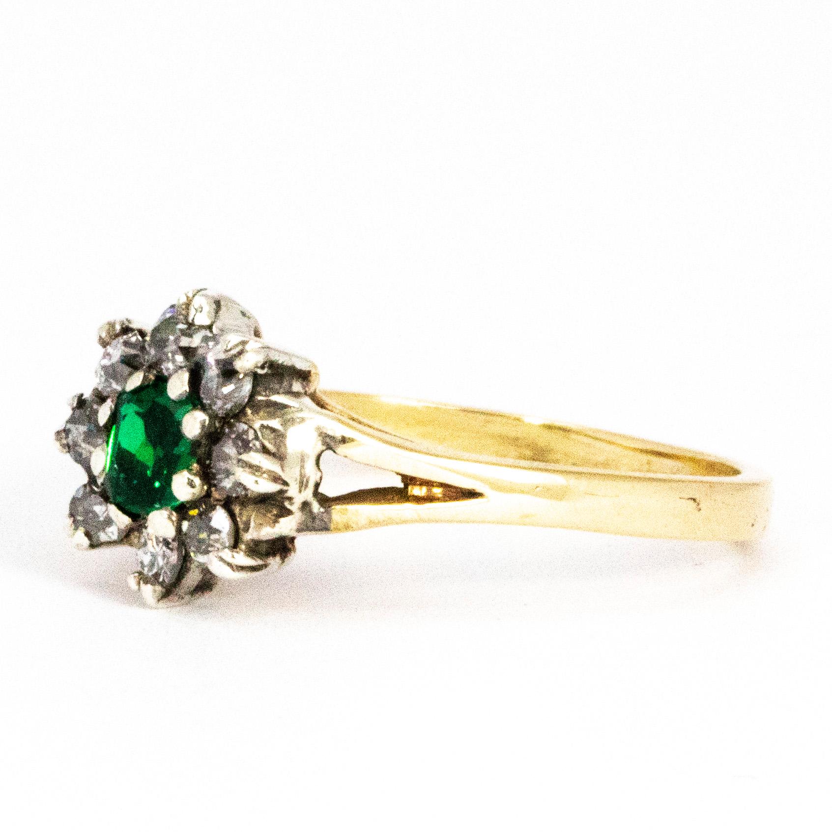 Sat at the centre of this gorgeous cluster is  35pt emerald and surrounding the wonderfully deep green stone are a halo of sparkling old mine cut diamonds measuring a total of 40pts. 

Ring Size: N 1/2 or 7
Cluster Diameter: 9.5mm