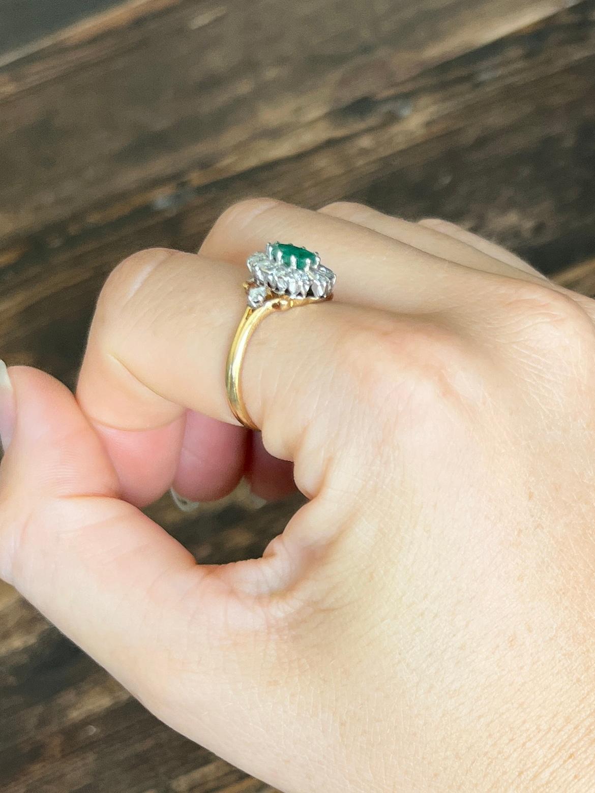 This stunning cluster boasts a 75pt emerald at the centre of it. Surrounding the beautiful green stone are diamonds totalling 48pts. All modelled in 18carat gold and stones set in platinum. 

Ring Size: P or 7 3/4 
Cluster Dimensions: