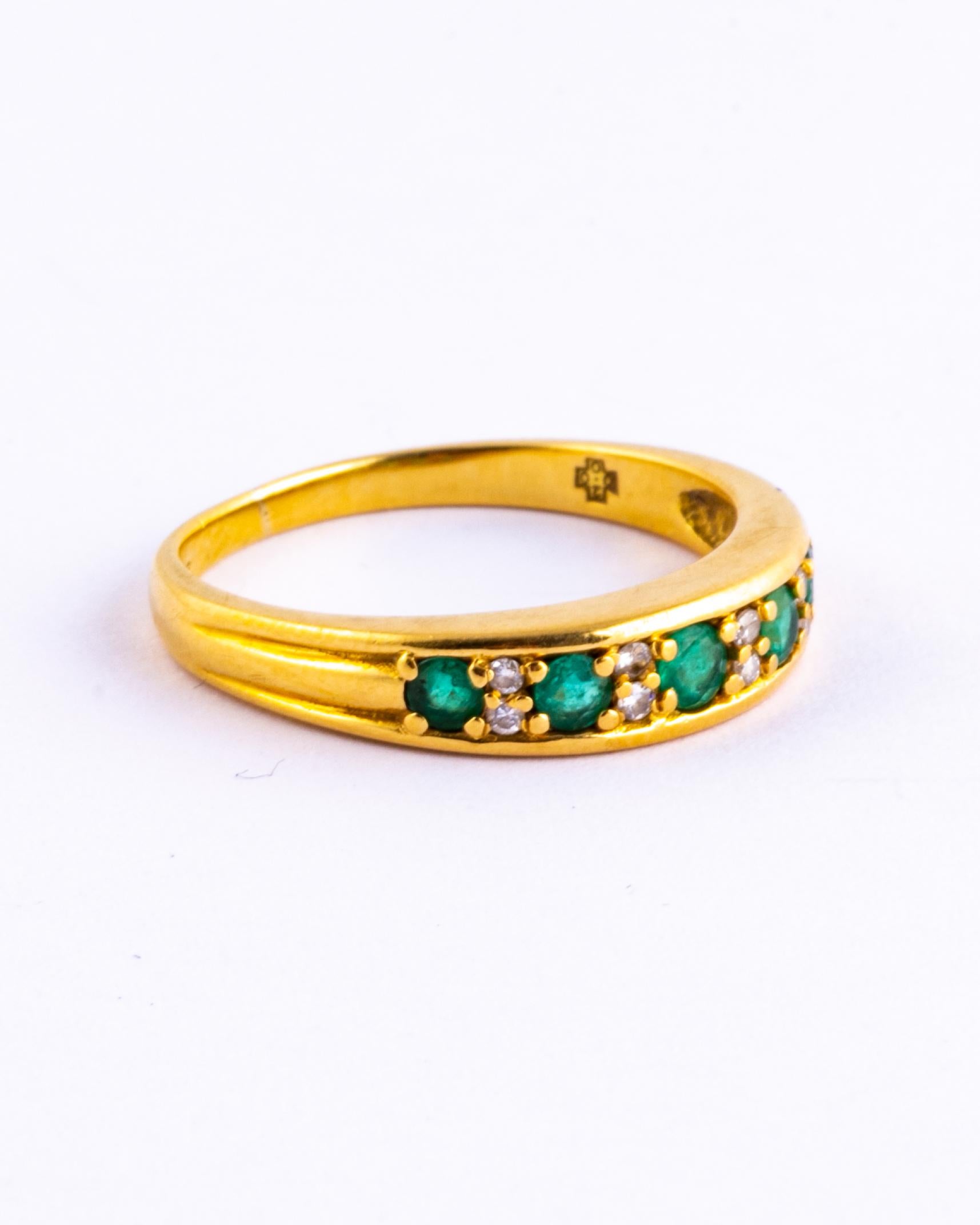 The emeralds in this ring are beautiful and bright and measure 10pts each. In between the gorgeous green stones are pairs of diamonds which measure 2pts each. The ring is modelled in 18carat gold.

Ring Size: Q 1/2 or 8 1/2 
Band Width: 4mm

Weight: