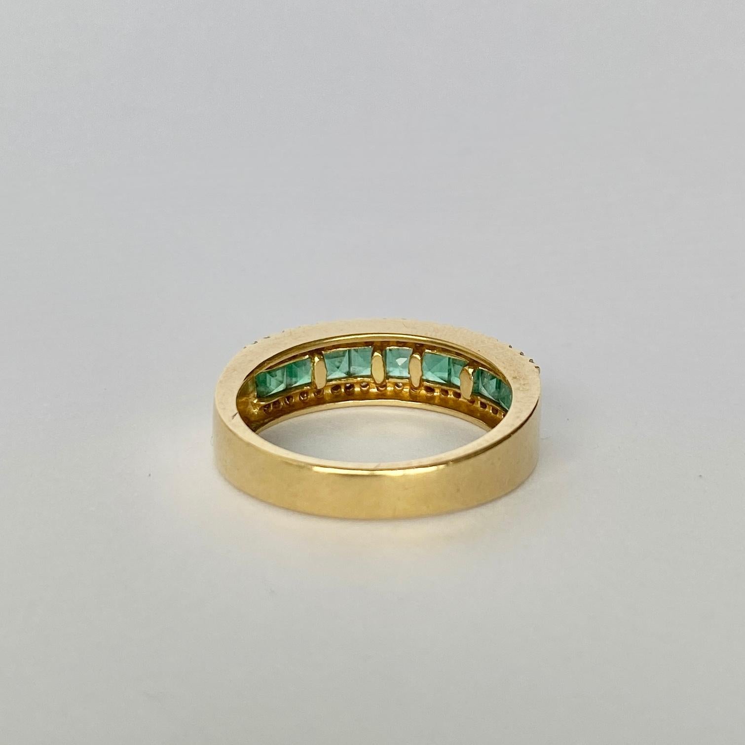 The square cut emeralds in this ring are beautiful and bright and measure 10pts each. Either side of the row of emeralds are two rows of diamonds. Each row total approx 20pts of diamonds. The ring is modelled in 18carat gold.

Ring Size: P or 7