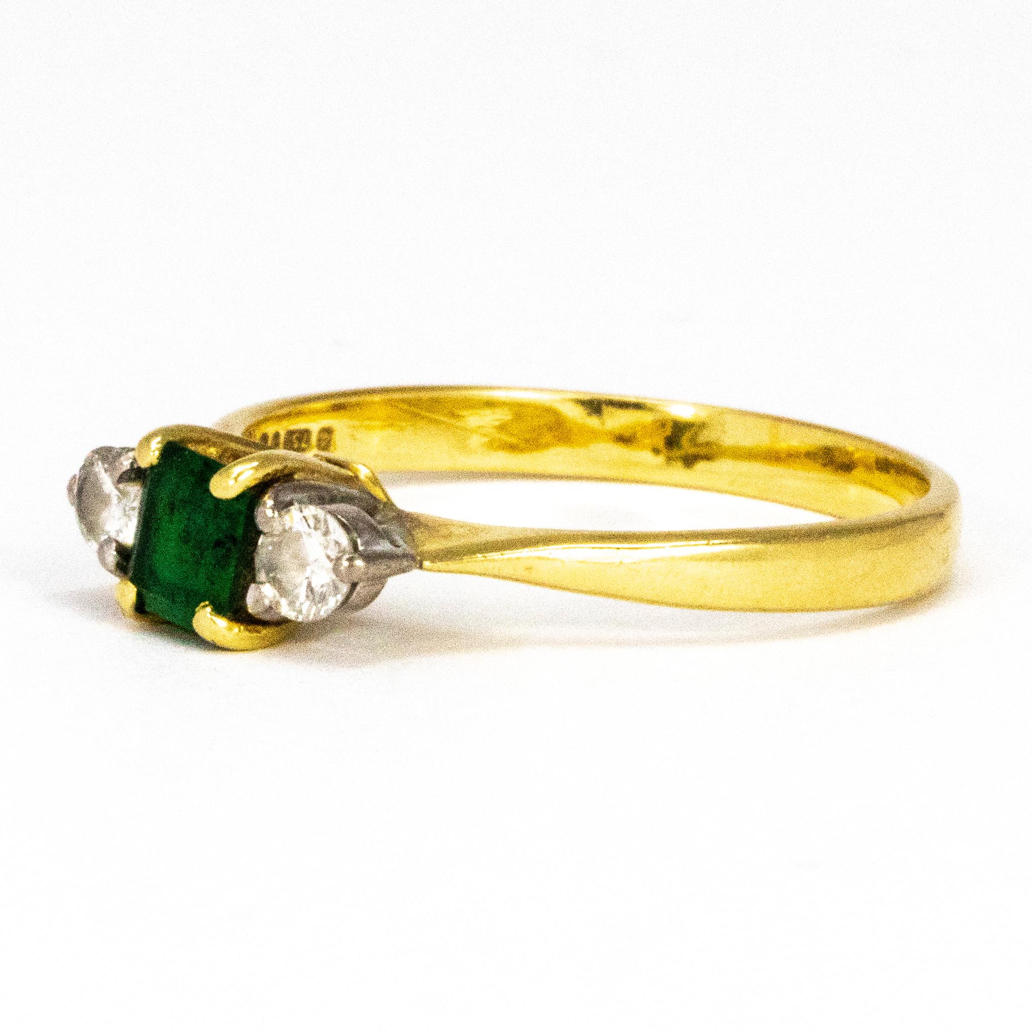 Set in between two gorgeous round cut 10pt diamonds sits a stunning deep green emerald measuring 40pts. The stones are set in simple claw settings and the ring is modelled in 18ct gold.

Ring Size: P 1/2 or 7 3/4