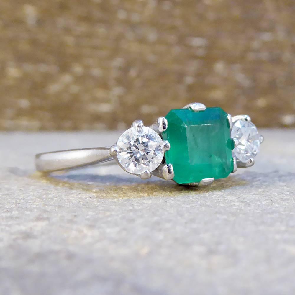 These three beautifully sparkly gemstones are set in an 18ct white Gold eight and four claw setting, with the Diamonds weighing 0.50ct in total and a luxurious 1ct enchanting asher cut Emerald in the centre. This vintage ring has been crafted with