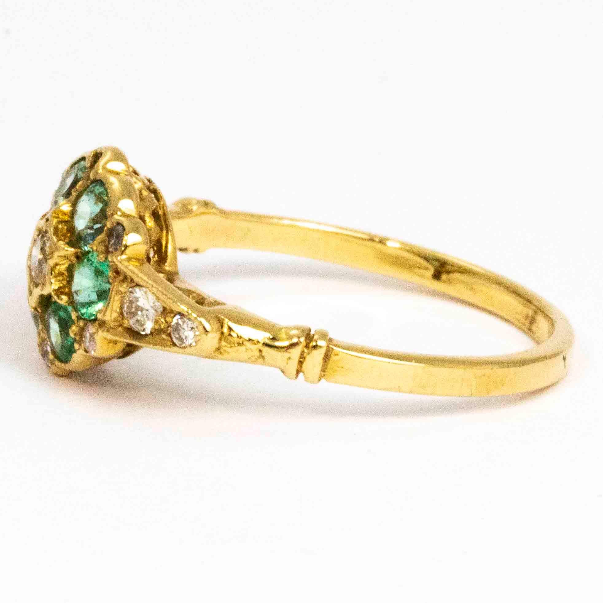 The glistening bright green emeralds in this ring are simply stunning. The cluster also hold sparkling diamonds and is modelled in ct gold. The centre diamond measures 9pts, the emeralds measure 10pts each and the shoulders hold diamonds measuring a
