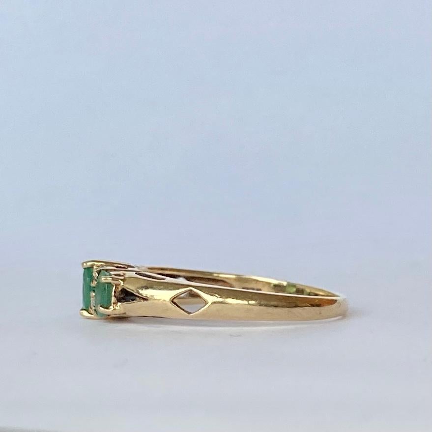 This gorgeous three stone holds three emeralds which total 60pts and in between them sit two pairs of diamond points. The ring is modelled in 9ct.

Size: O 1/2 or 7 1/2 
Width: 5mm

Weight: 2.2g