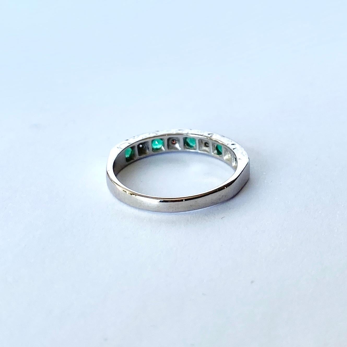 The emeralds in this ring are beautiful and bright and measure 5pts each. In between the gorgeous green stones are diamonds which measure 2pts each. The ring is modelled in 9carat white gold.

Ring Size: K 1/2 or 5 1/2 
Band Width: 3.5mm

Weight: