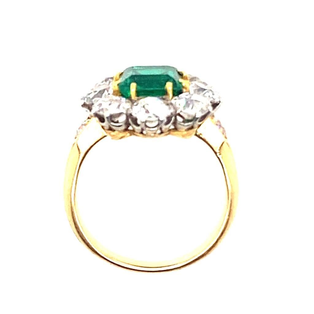 Women's Vintage Emerald and Diamond Cluster 18 Karat Yellow Gold Engagement Ring For Sale
