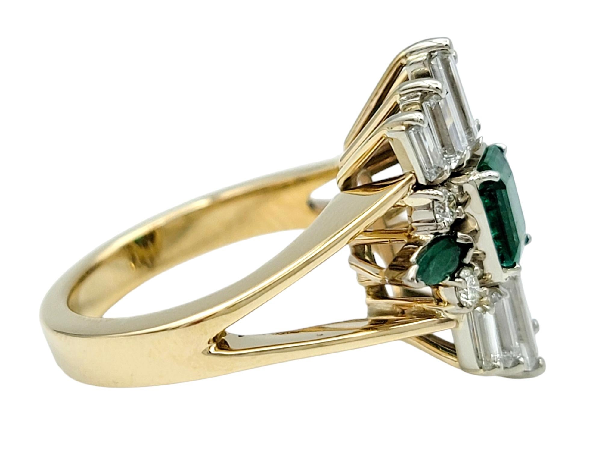 Emerald Cut Vintage Emerald and Diamond Cluster Split Shank Cocktail Ring in 14 Karat Gold For Sale