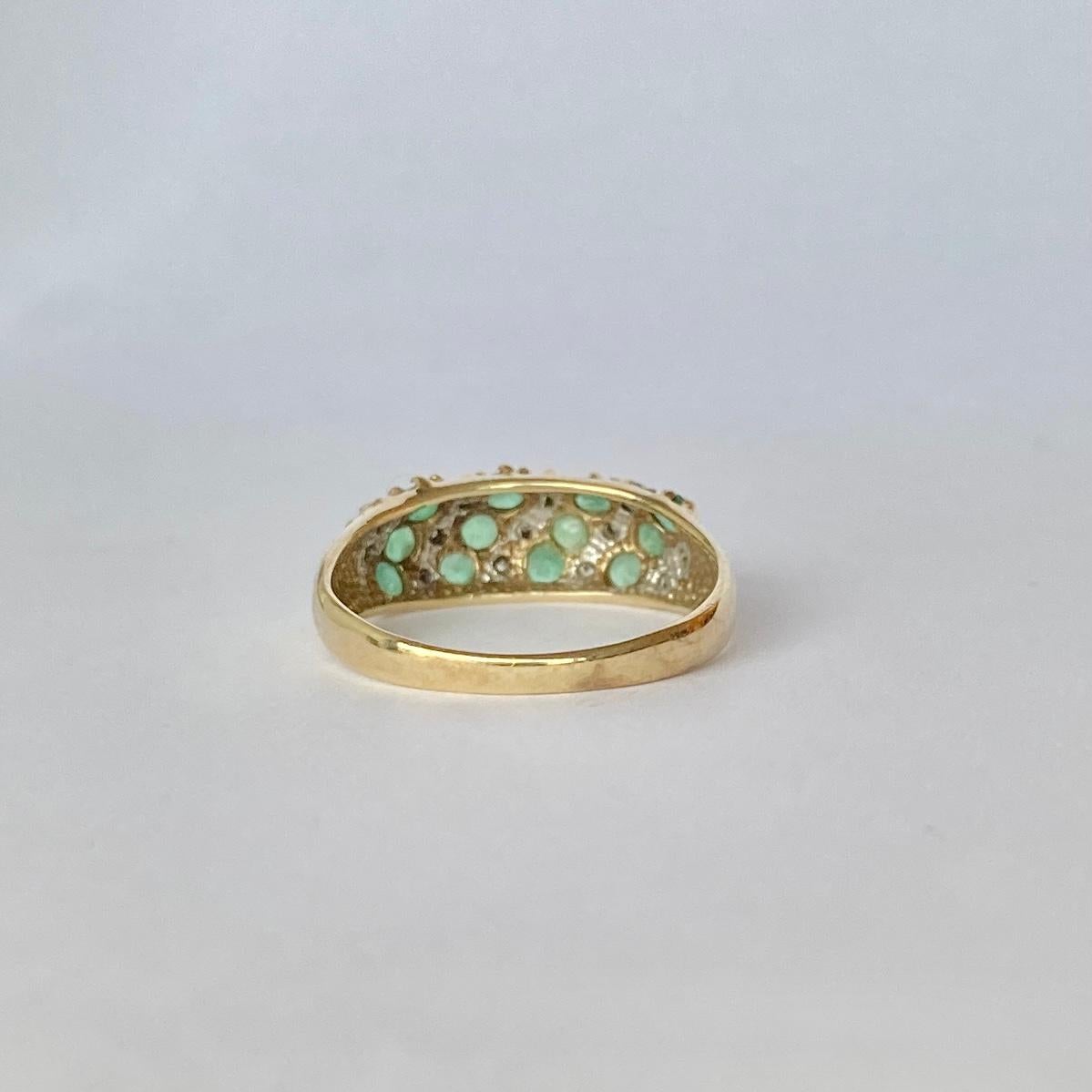 The emeralds in this ring are beautiful and bright and total 60pts. In between the gorgeous green stones are diamond points in rows. The ring is modelled in 9carat gold.

Ring Size: L or 5 3/4
Band Width: 7mm

Weight: 2g