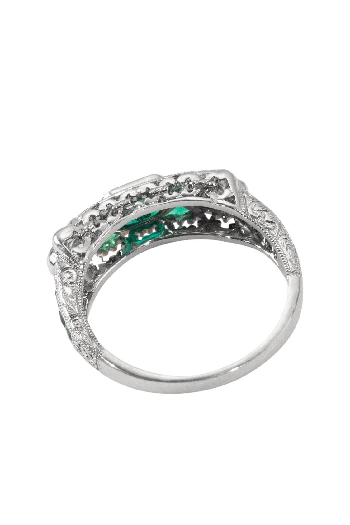 A beautiful vintage engagement ring from England circa 1980. 
The ring is platinum with emeralds (0.71 ct) and two diamonds (0,7 ct). 
✓ Worldwide insured shipping. 
✓ Ready for dispatch within approx 24 hours.
Free resizing. However, a return or an