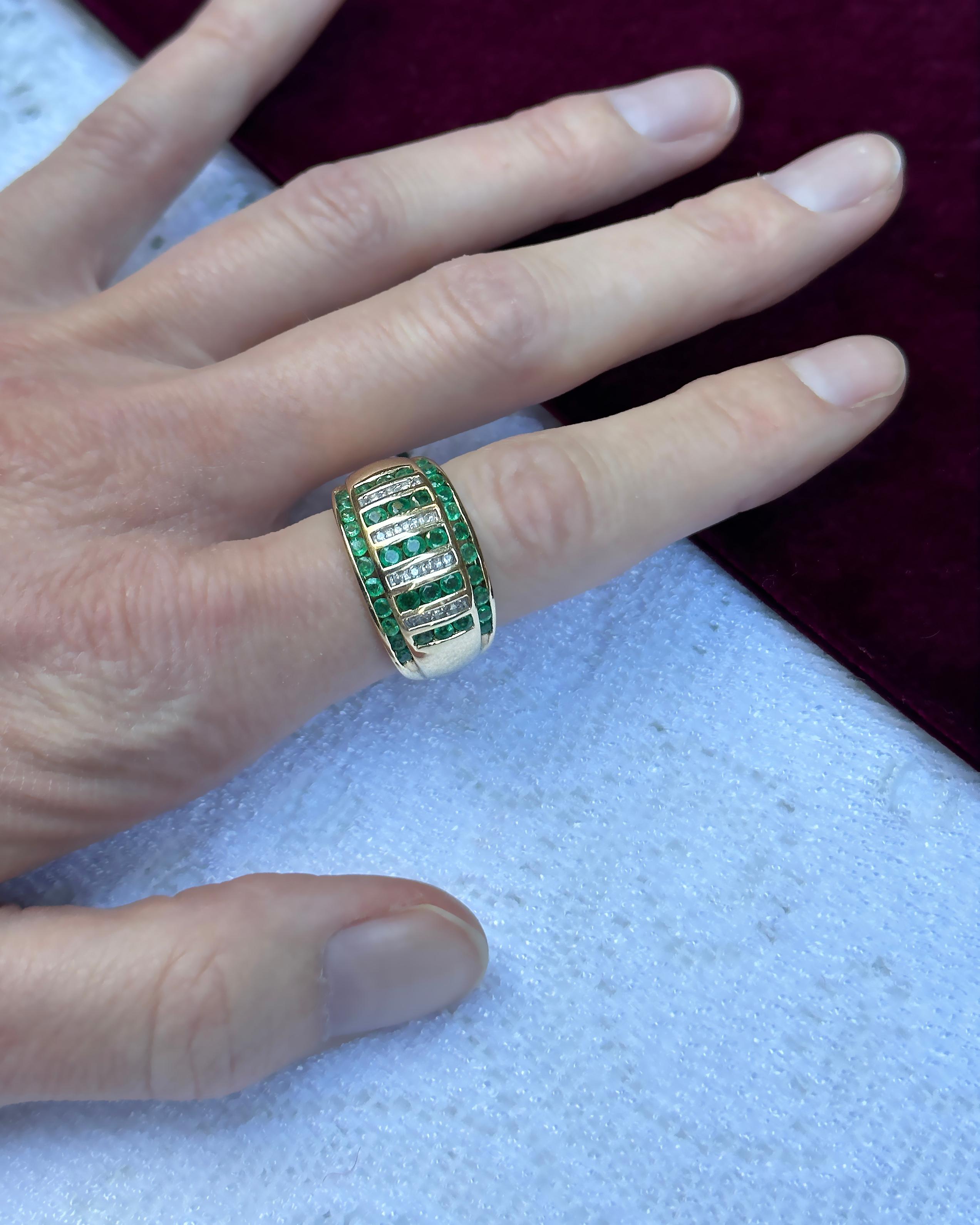 This vintage emerald and diamond bombe ring is a chic and timeless addition to your treasured jewelry collection. It's so special, yet also works for everyday wear, and stacks so well with other rings. Round diamond and emeralds are channel-set into