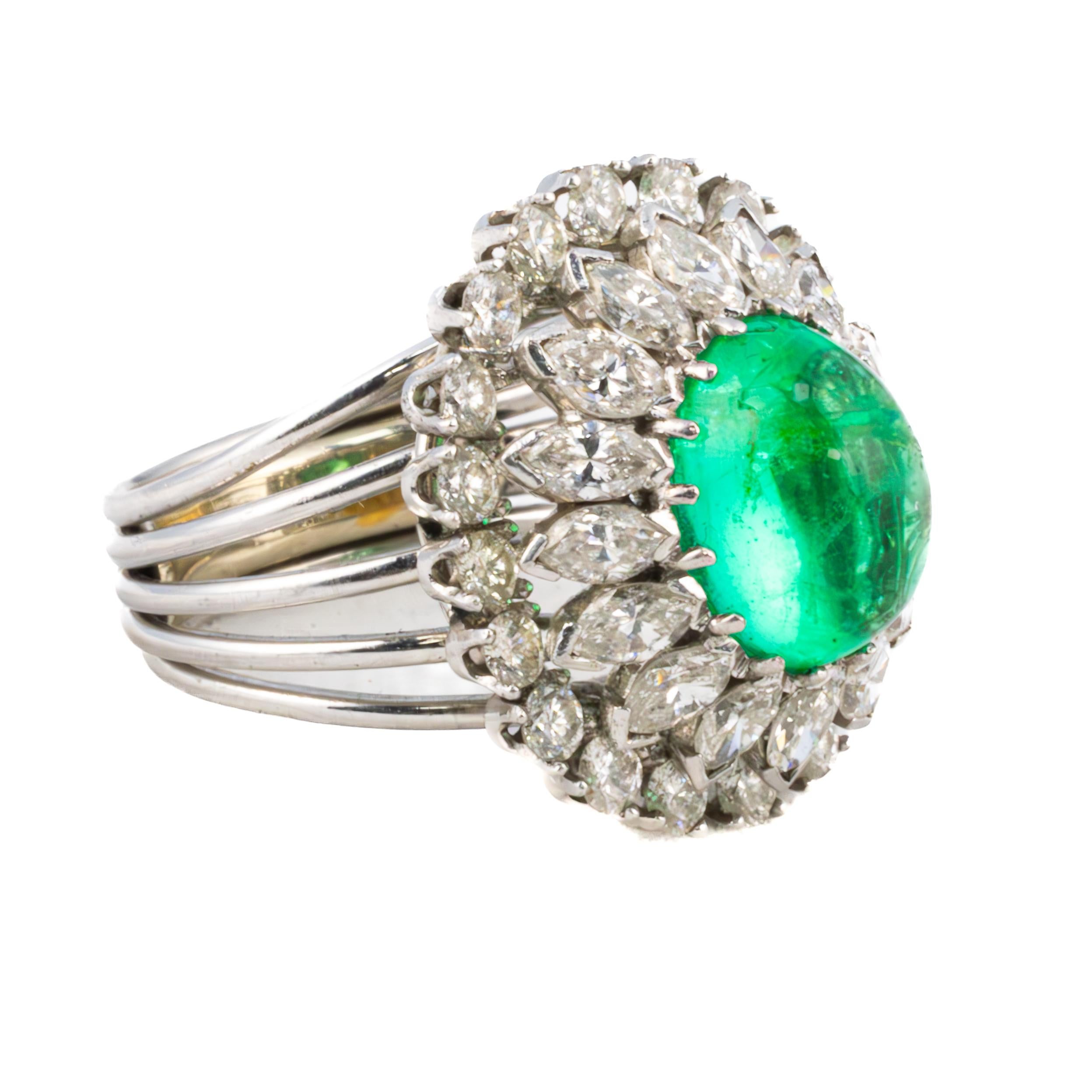 Vintage Emerald and Diamond Halo Cocktail Ring

A statement of elegance and opulence, this vintage emerald and diamond halo cocktail ring is an extraordinary piece of jewelry artistry. At its heart, a mesmerizing deep green cabochon-cut emerald is