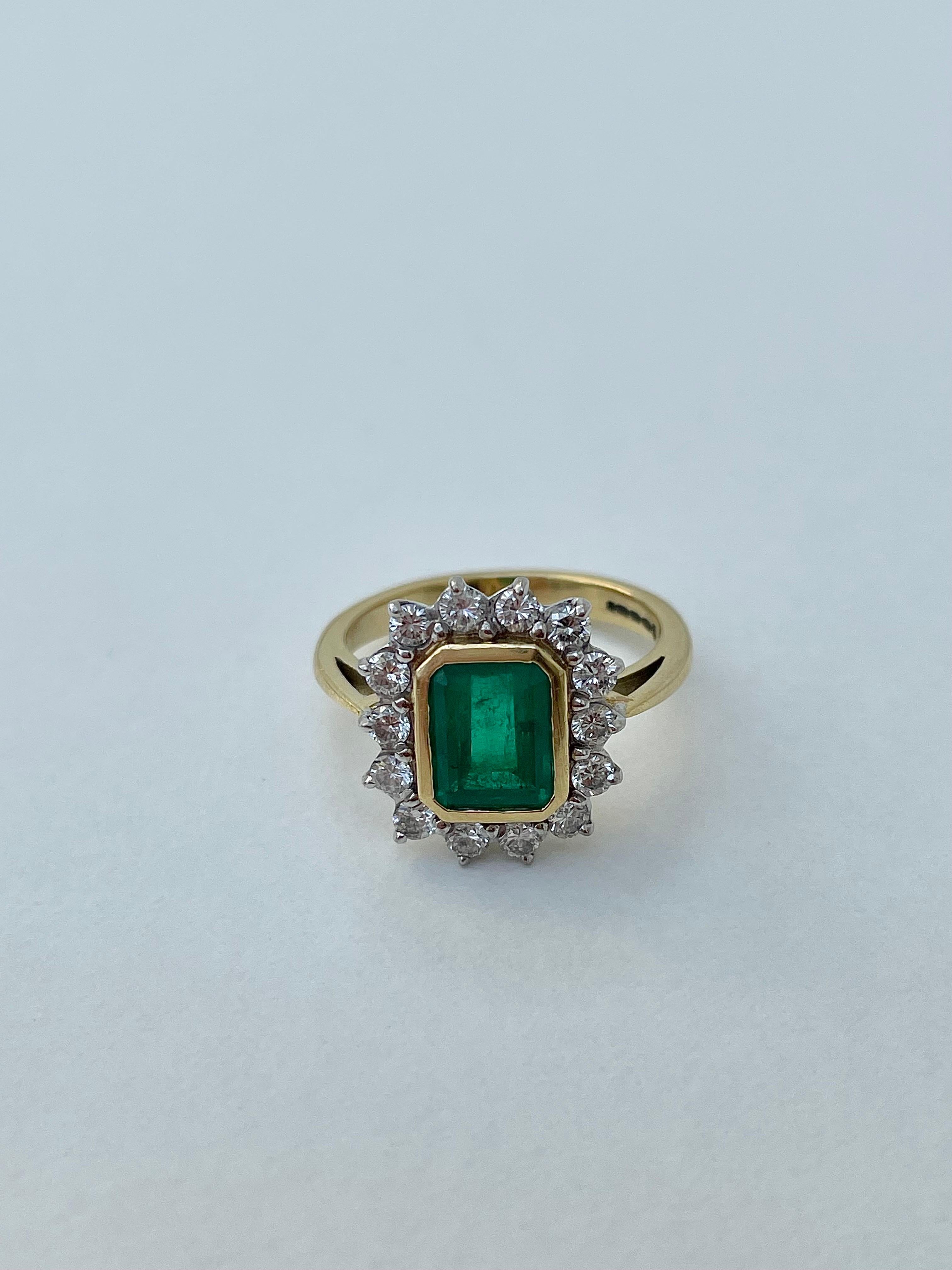 Vintage Emerald and Diamond Halo Ring, 18ct Yellow Gold 

outstanding diamond and emerald ring, it’s an incredible statement piece 

The item comes without the box in the photos but will be presented in a  gift box

Measurements: weight 6.43g, size