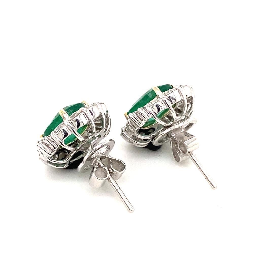 Oval Cut Vintage Emerald and Diamond Platinum Cluster Earrings, Circa 1980 For Sale