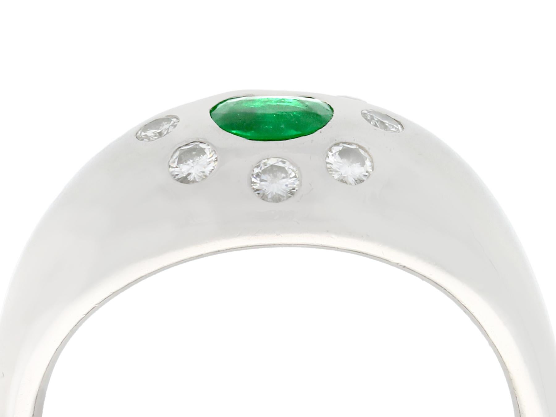 A fine and impressive 0.35 carat emerald and 0.18 carat diamond, platinum cocktail ring; part of our diverse antique jewelry and estate jewelry collections.

This fine and impressive diamond and emerald ring has been crafted in platinum.

The domed
