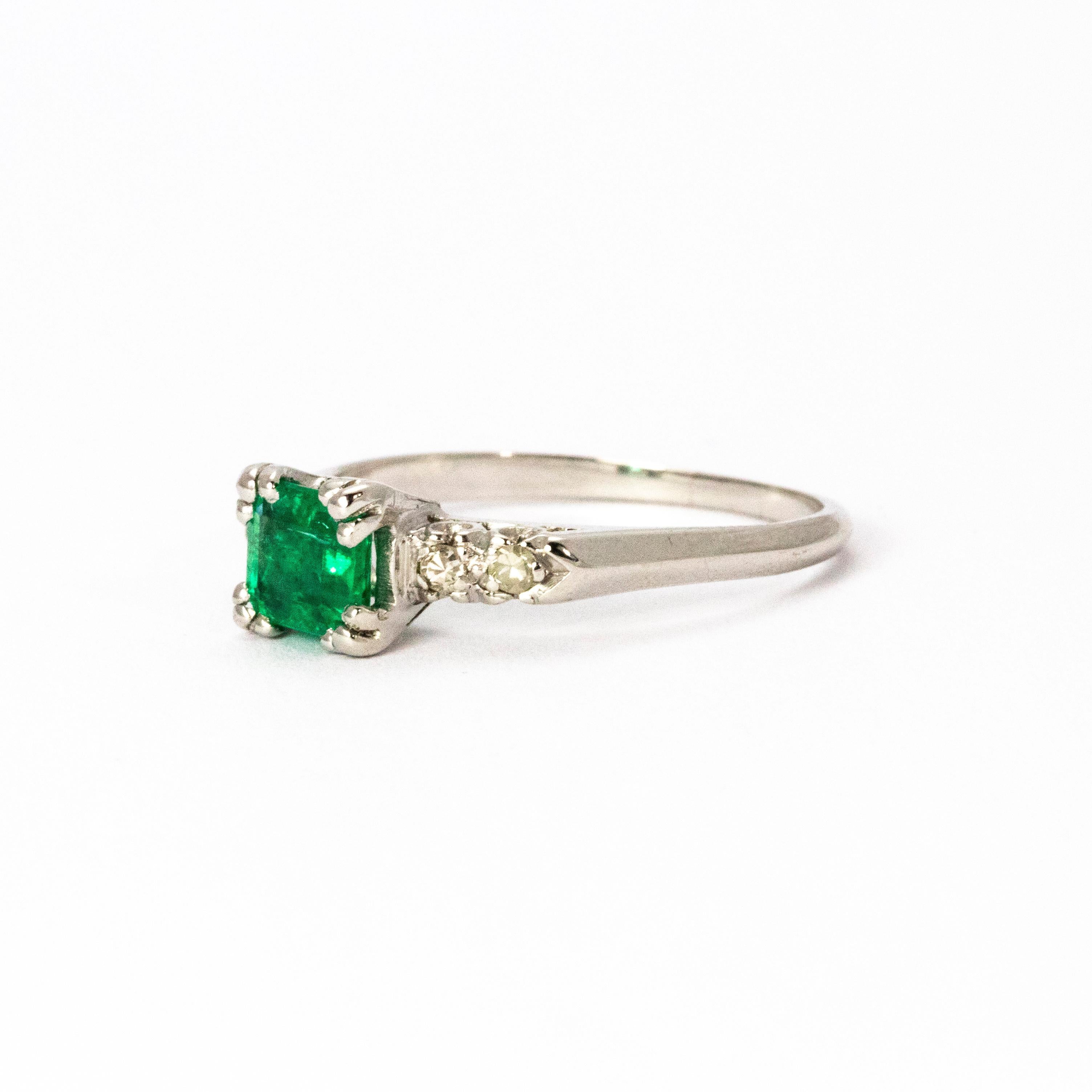 A wonderful vintage emerald and diamond solitaire ring. Boasting a beautiful emerald in a classic four-claw setting, and complemented by elegant diamond shoulders. Modelled in platinum.

Ring size: O 1/2 or 8