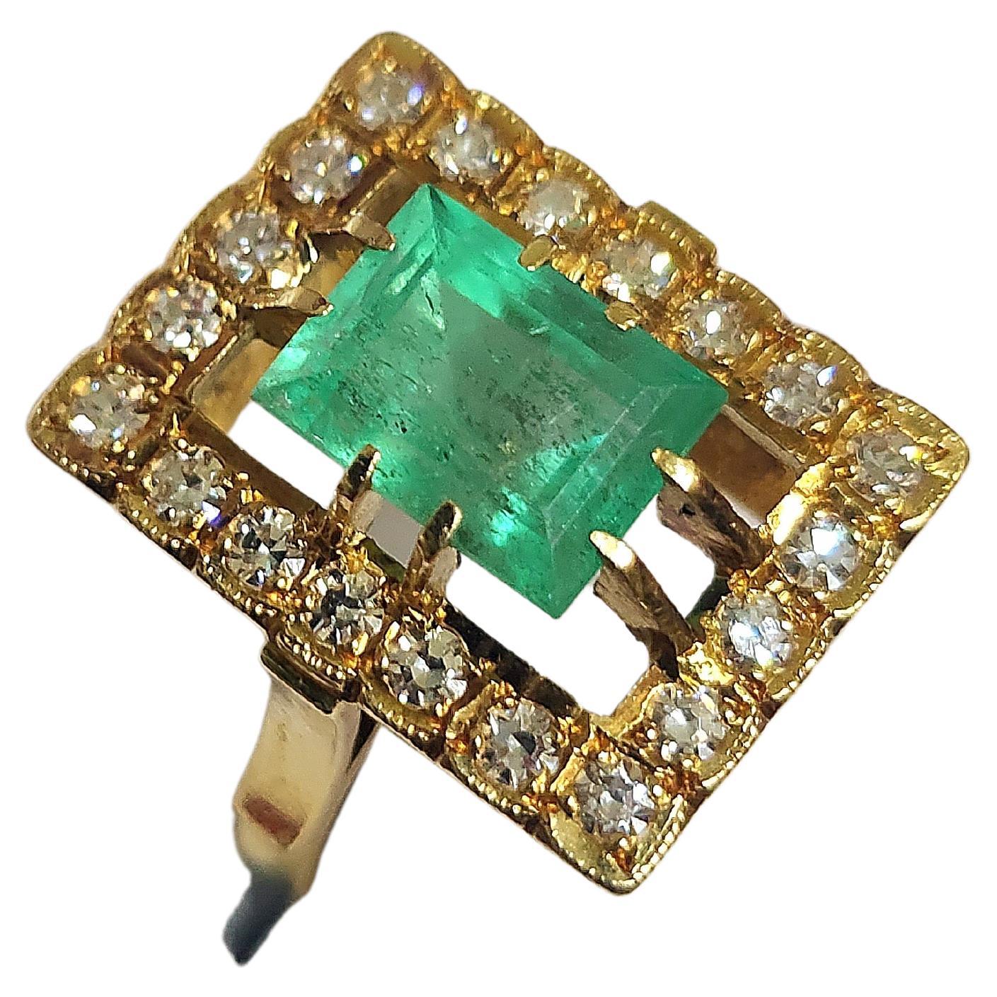 Vintage soviet union era 1960/1970s 14k yellow gold ring centered with natural green emerald in emerald cut estimate weight of 1.70 carats flanked with brilliant cut diamonds estimate weight 0.65 carats ring head diameter 13mm×18mm was made during