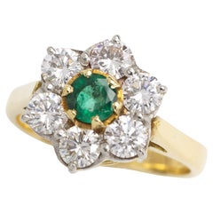 Anello vintage con smeraldo e diamante in oro 18 carati