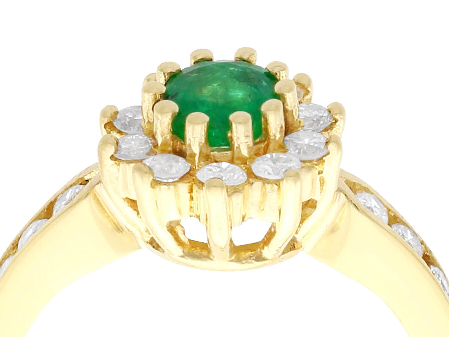 A very good 0.30 carat natural emerald and 0.38 carat diamond, 18 karat yellow gold cluster ring; an addition to our vintage jewelry collections.

This vintage cocktail ring has been crafted in 18 karat yellow gold.

The pierced decorated boat style