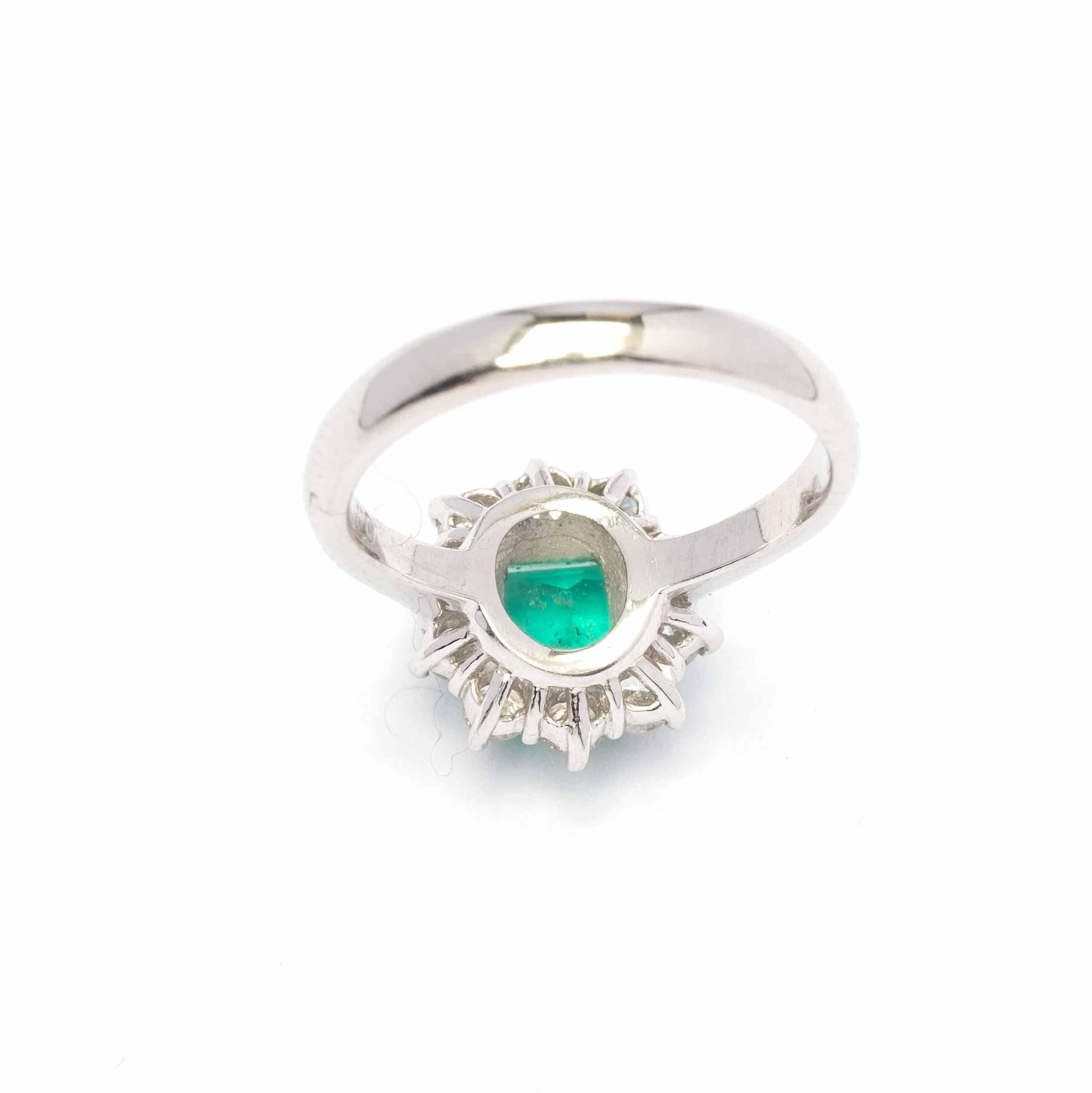 Vintage ring set in platinum with emerald of good colour surrounded by round cut diamonds of 0.40 ct total c.a.

Highlights:
- Vintage
- 18ct gold
- Natural emerald 0.77 ct c.a.
- Diamonds round cut 0.415 ct total

Measurements
- Length 1.1 cm x