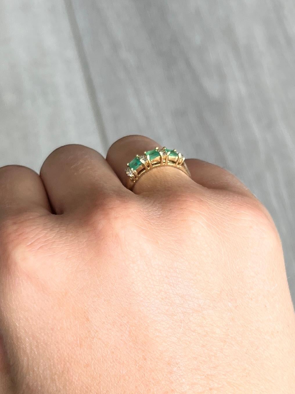 This gorgeous three stone holds three emeralds which total 45pts and in between them sit four pairs of white sapphires totalling 8pts. The ring is modelled in 9ct.

Size: J 1/2 or 5
Width: 3.5mm

Weight: 1.6g