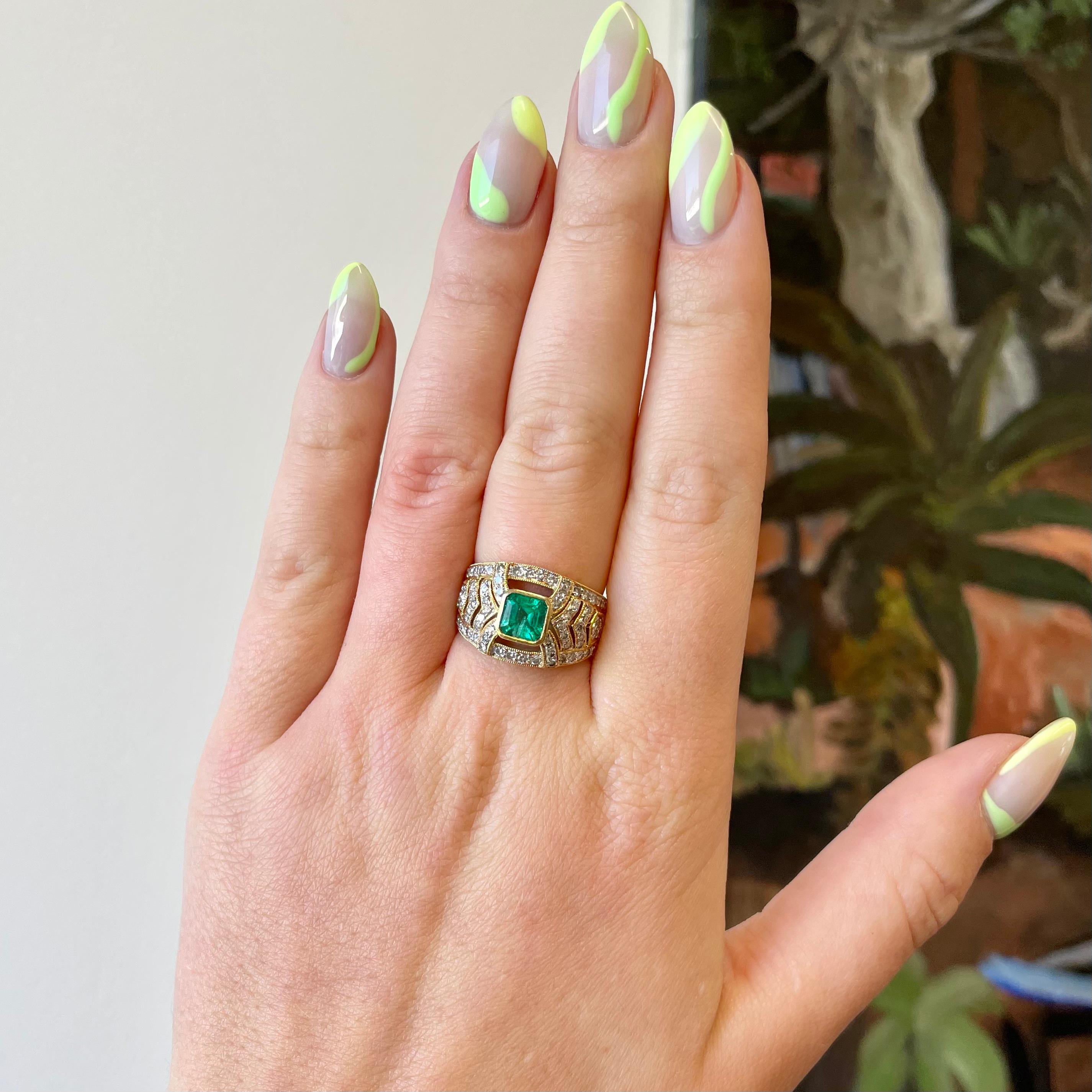 Are you looking for a color-stone ring with character? Consider this Vintage Emerald Diamond 18k Gold Ring. The vivid green color of this emerald is enchanting and pleasant to the eye. Yellow gold and green emerald is an excellent combination and it