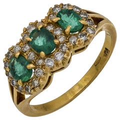 Anello vintage con smeraldo e diamante in oro giallo 18 carati con 3 pietre