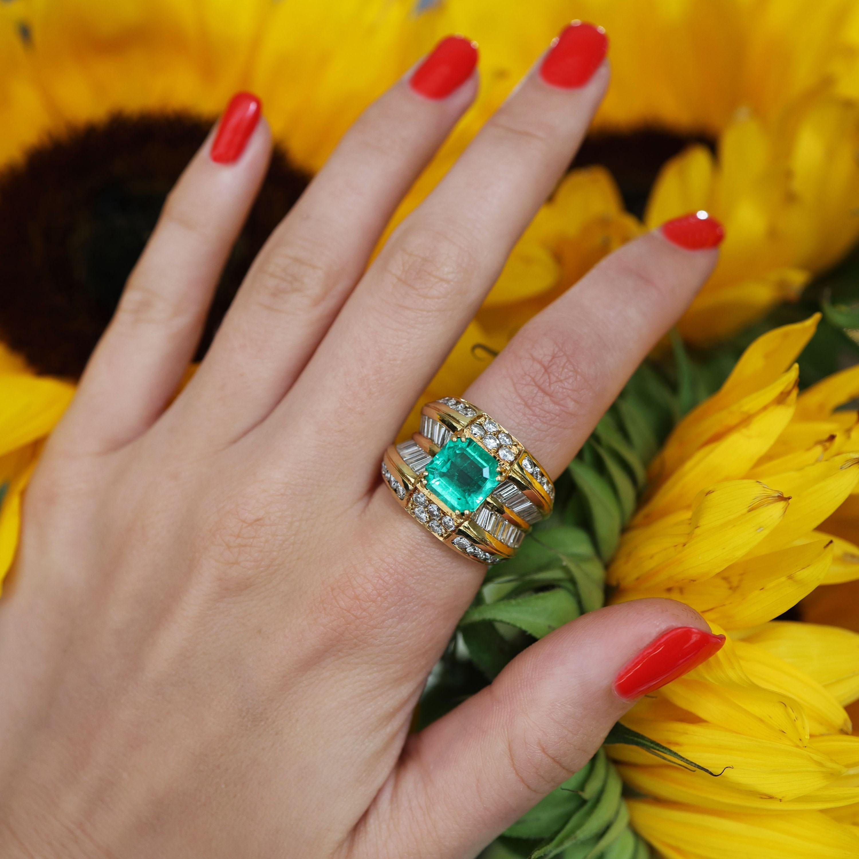 An emerald, diamond and gold dress ring, with an emerald-cut emerald, weighing approximately 3.00 carats, accompanied by a Gem & Pearl Laboratory certificate, stating that the emerald is natural, with moderate clarity enhancement, with indications
