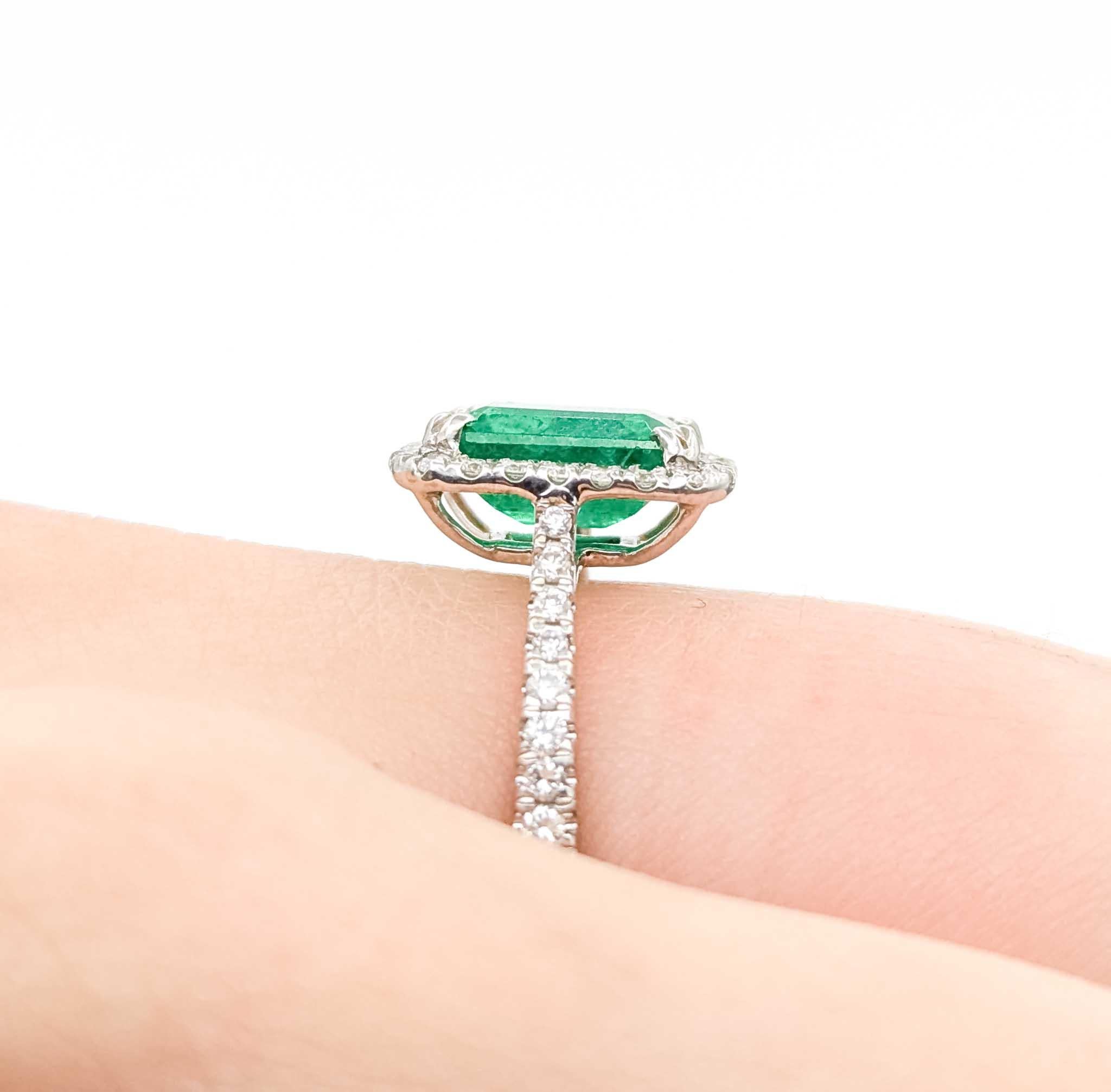 Emerald Cut Vintage Emerald Diamond Halo Ring in 14k White Gold For Sale