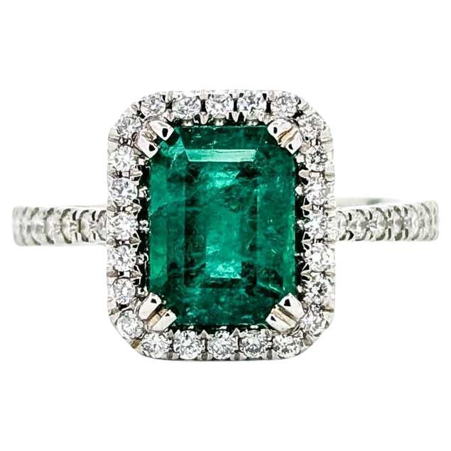 Vintage Emerald Diamond Halo Ring in 14k White Gold For Sale