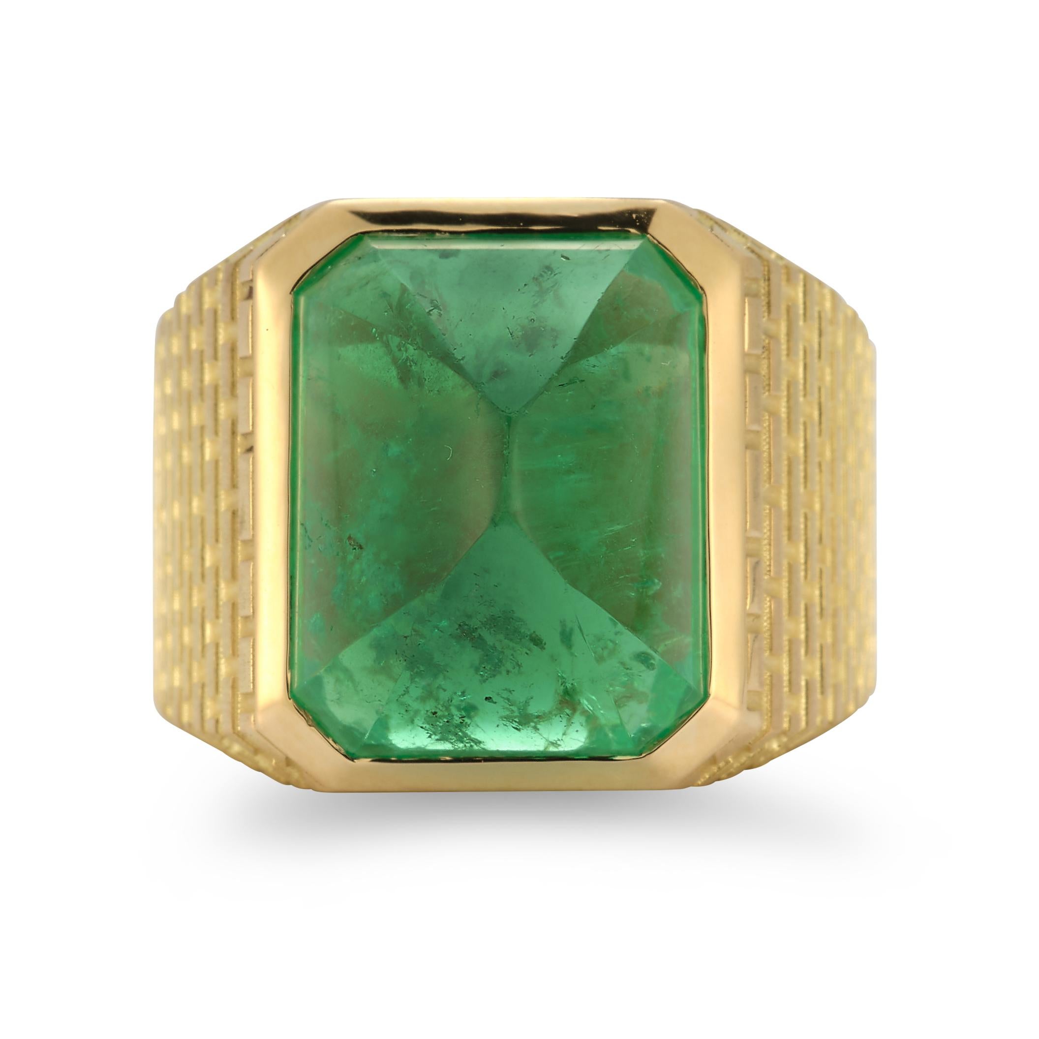 Vintage Emerald Pyramid Gold Ring

A statement of grandeur and sophistication, this vintage ring showcases a striking pyramid-cut emerald, its lush green hue glowing with depth and mystery. Set in a bold, textured 18K yellow gold mounting, the