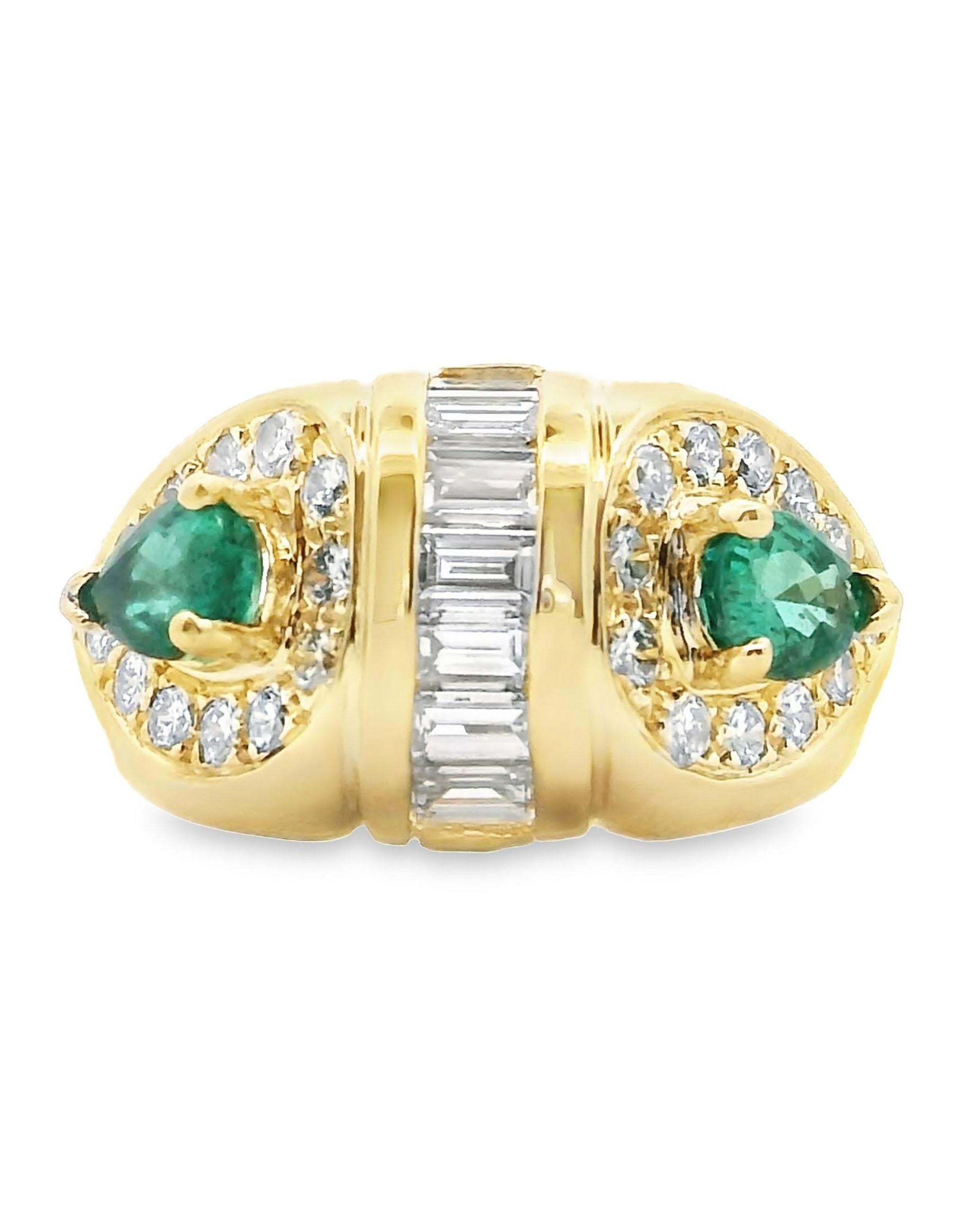 Circa 1985, 18K yellow gold ring with 2 pear shaped emeralds weighing 0.80 carats total, 7 baguette diamonds weighing 0.70 carats total, and 24 round brilliant-cut diamonds weighing 0.50 carats total. 

- Finger size 6
- Item is vintage but not