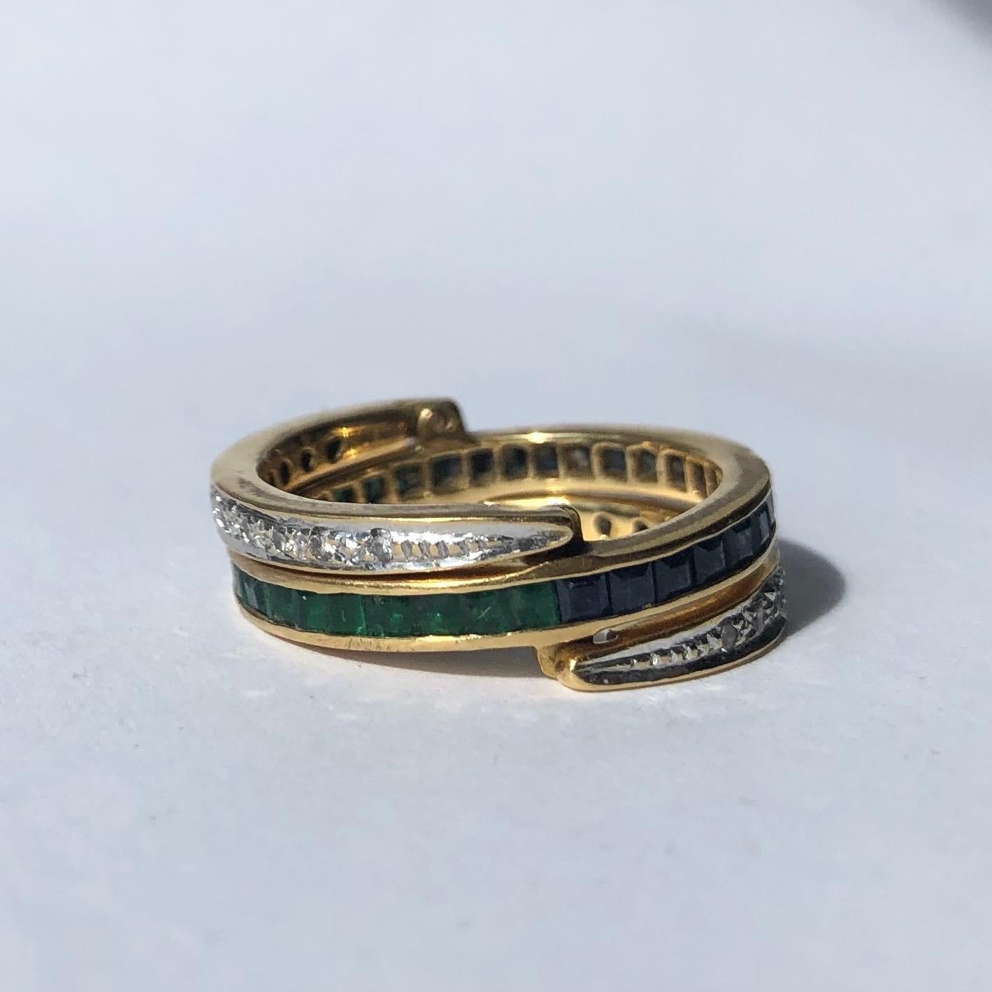 This ring is absolutely fabulous! The main central band is half sapphire and half emerald. Either side is a simple band of diamonds. You could wear this in so many ways. The sapphires and emeralds total approximately 90pts each and the diamonds