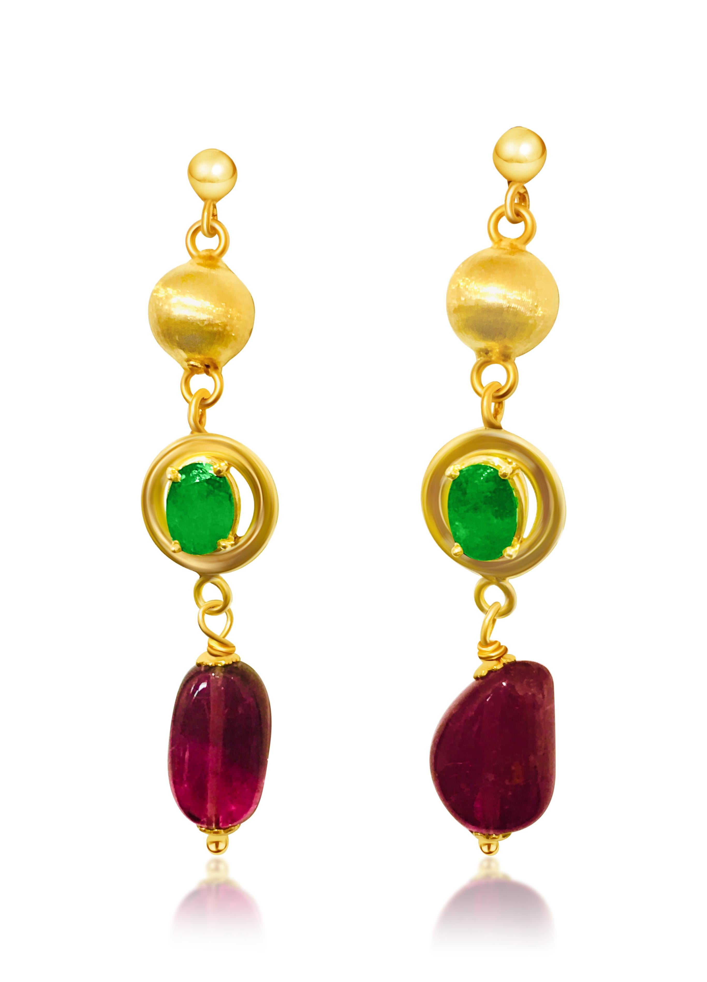Metal: 14K yellow gold. 
TCW of emeralds: 1.50 carats, oval cut set in prongs. 100% natural earth mined emerald. Gorgeous Colombian emerald, superb color and luster. 

TCW of tourmaline: 8.00 carats. Fancy shape tourmaline. Natural earth mined
