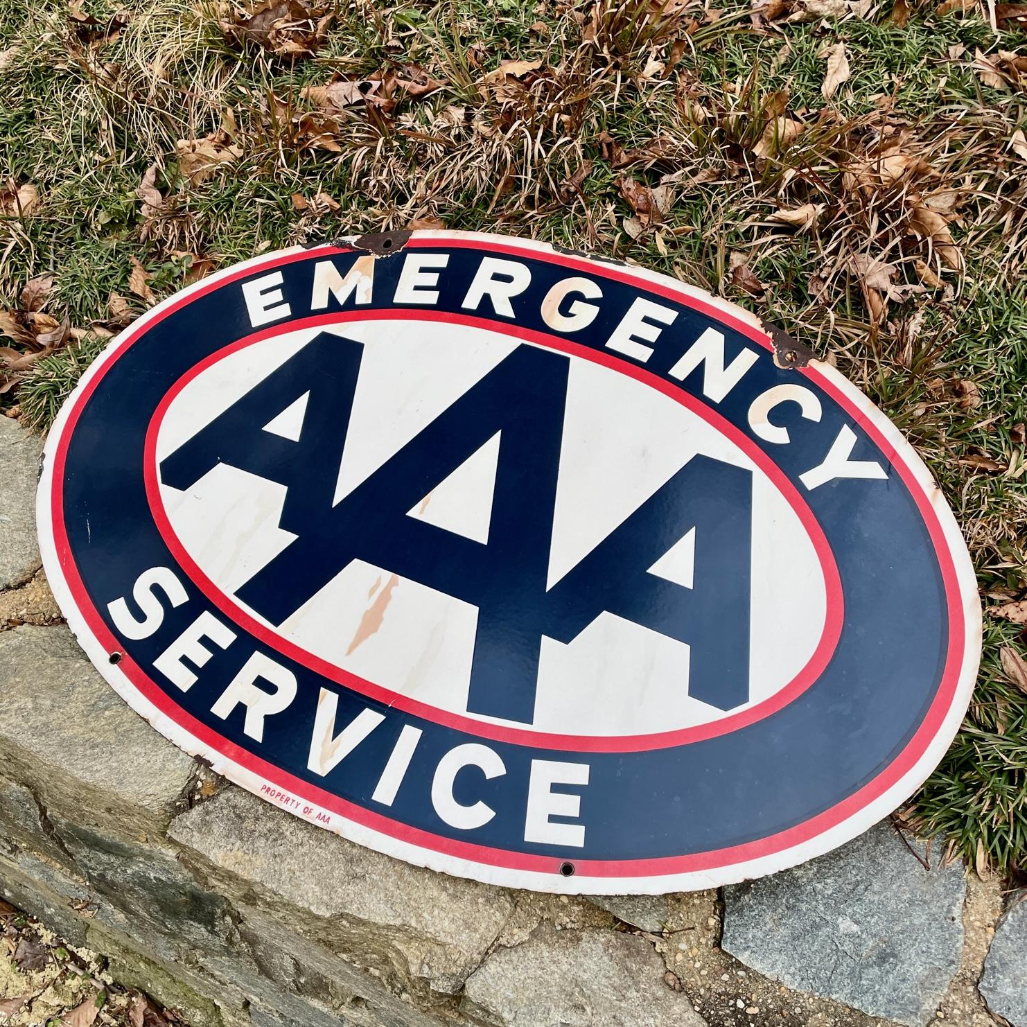 1950s AAA Emergency Service double-sided porcelain garage sign. Distressed condition, meaning some chips from being install back in the day, exposure to the elements, this item was used as intended. So we would say age appropriate wear, and some
