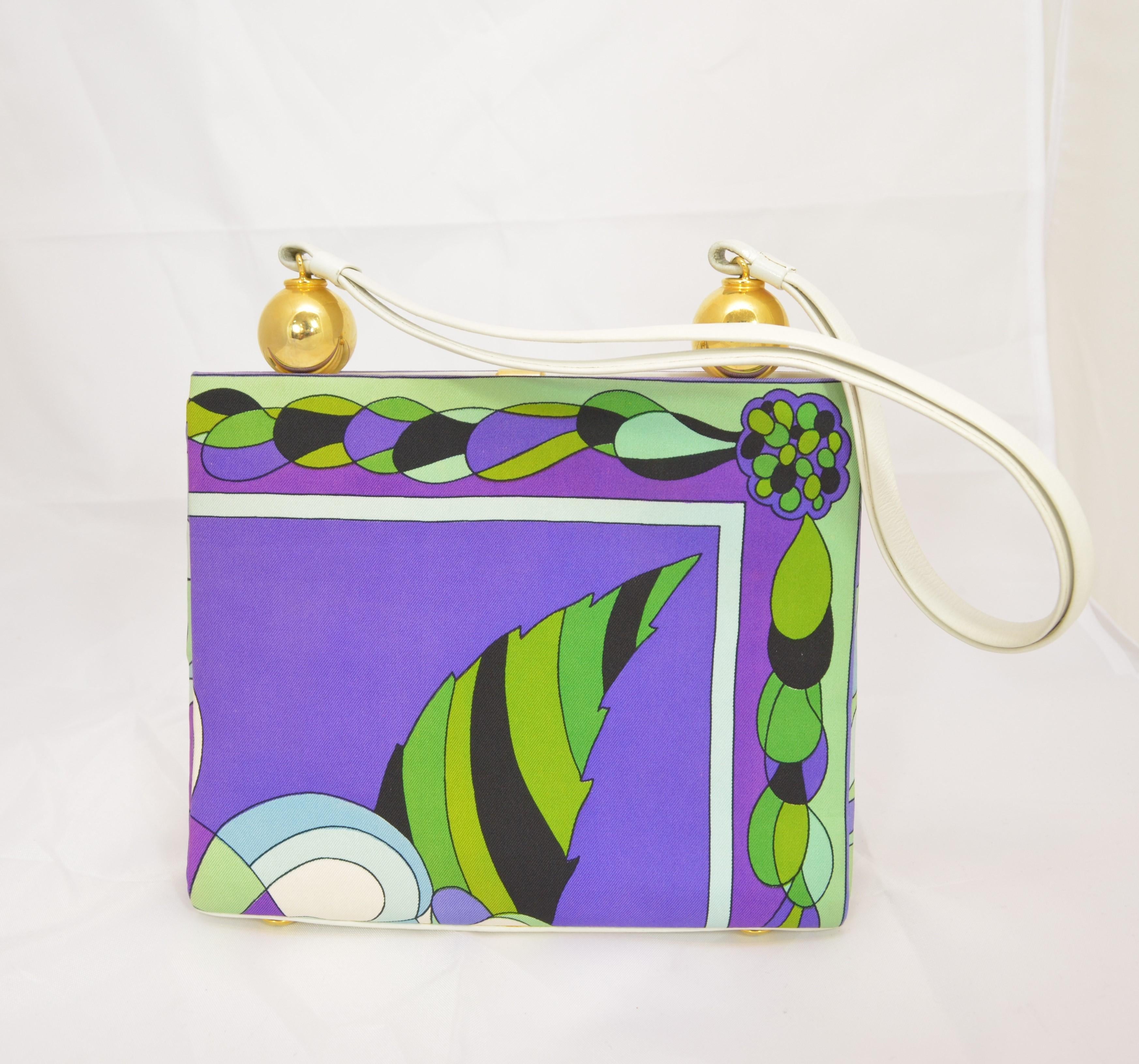 Vintage Emilio Pucci Satin Printed Top Handle Purse -- Purse features a multicolor print throughout a satin fabric with leather trimmings and top handle. Bag has gold-tone hardware throughout, three compartments with the center compartment having a