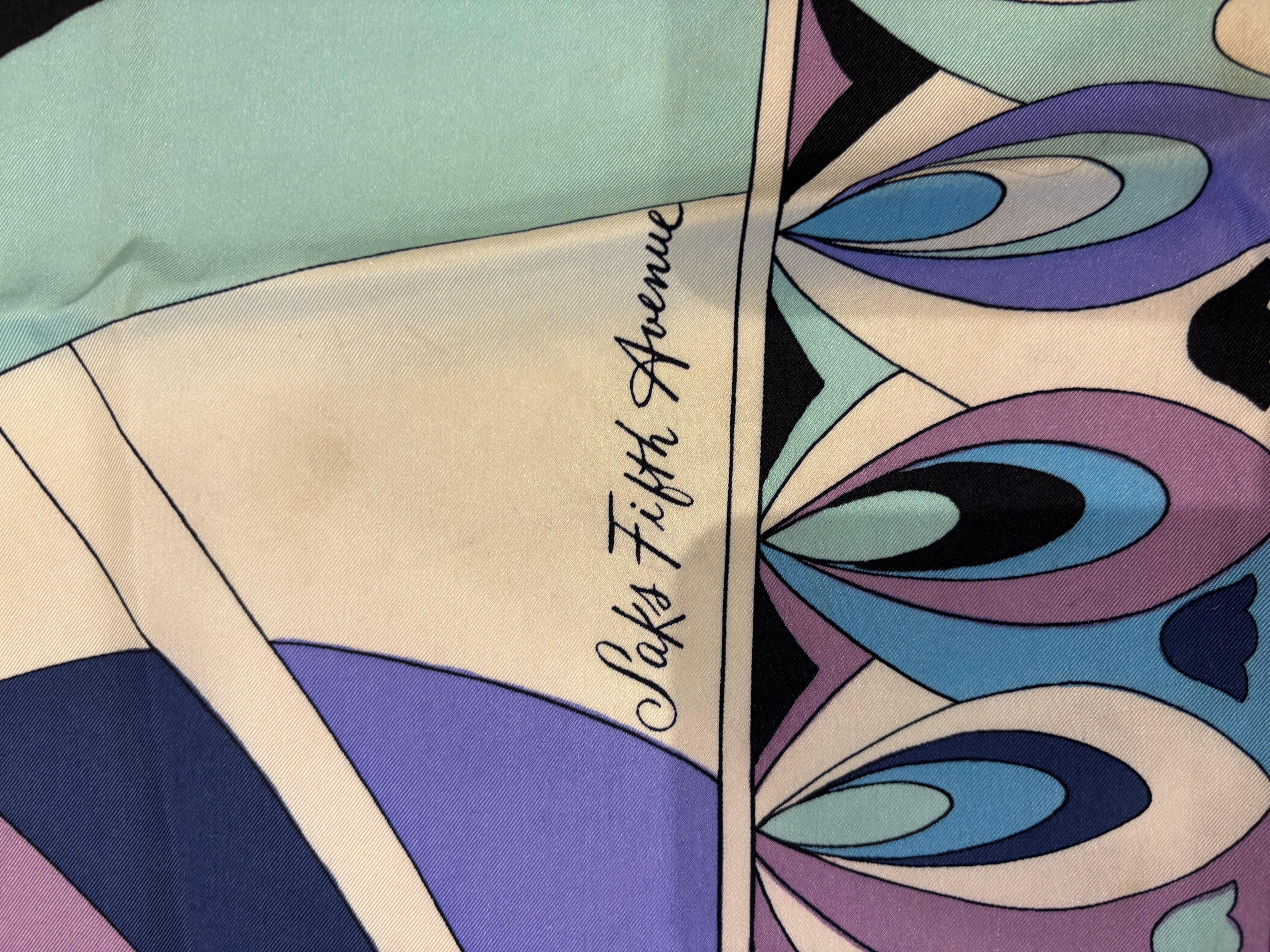 This is a rare silk scarf made for Saks Fifth Avenue by Emilio Pucci. We are not certain about the exact age of this scarf, but it would have been from the 60s or 70s. At that time did not always include the 