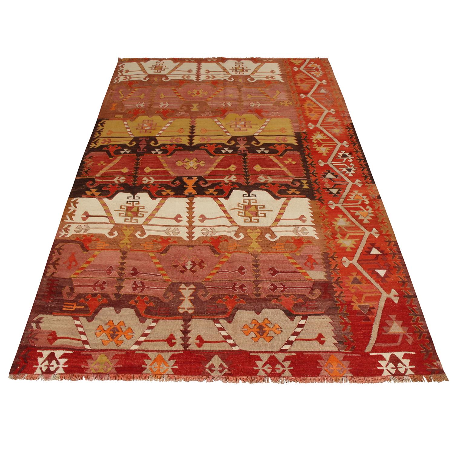 Flat-woven in high-quality wool originating from Turkey between 1940-1950, this vintage Emirdag Kilim rug stands apart from similarly ornate pieces of its family and era for the mixed-symmetry field design, departing from a traditional sense of