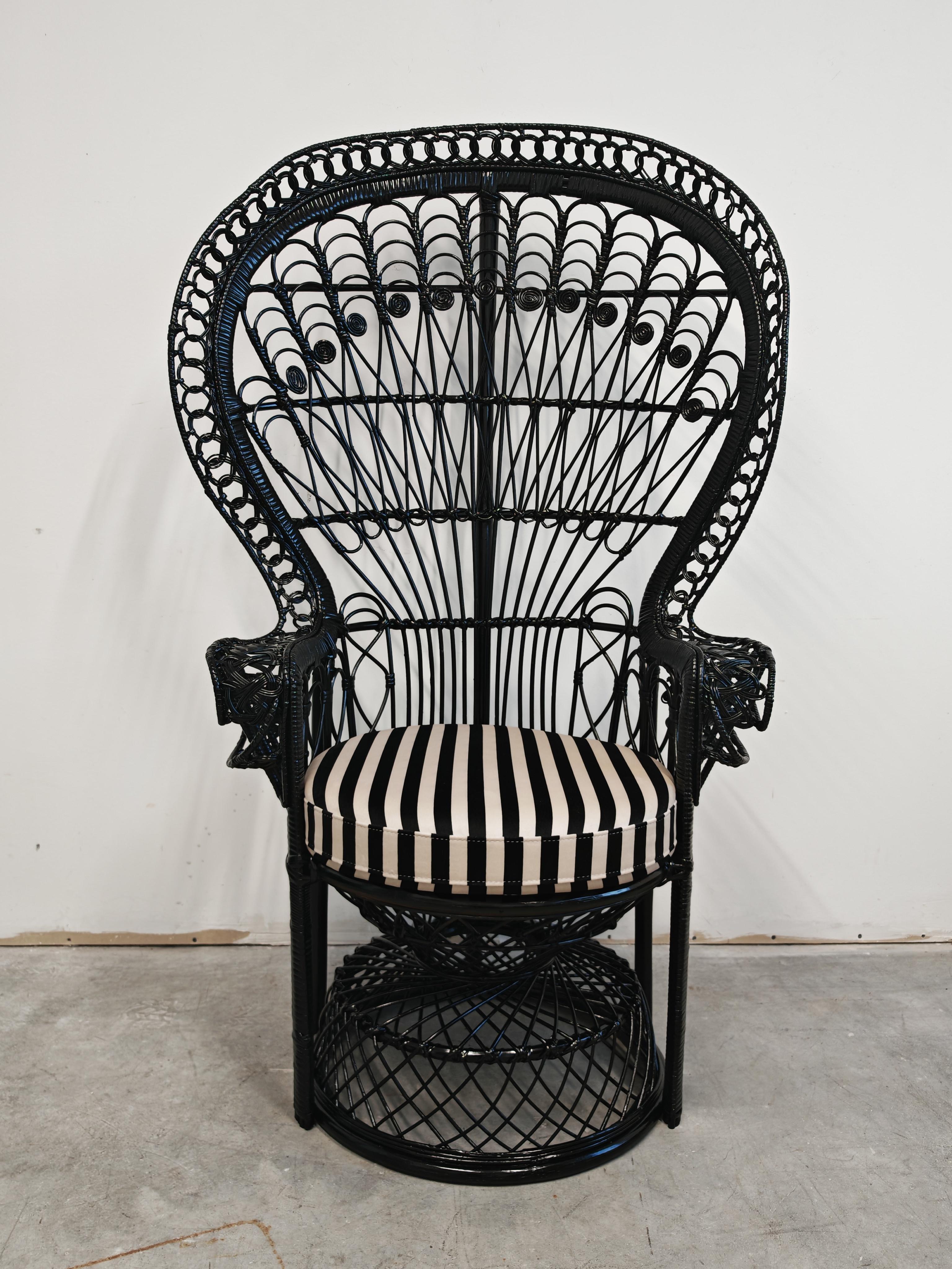 In this listing you will find the iconic wicker chair, commonly known as a Peacock or Emmanuelle fan back wicker chair. This exceptionally designed handwoven chair is a modern re-interpretation of the traditional peacock chair. Designed in the