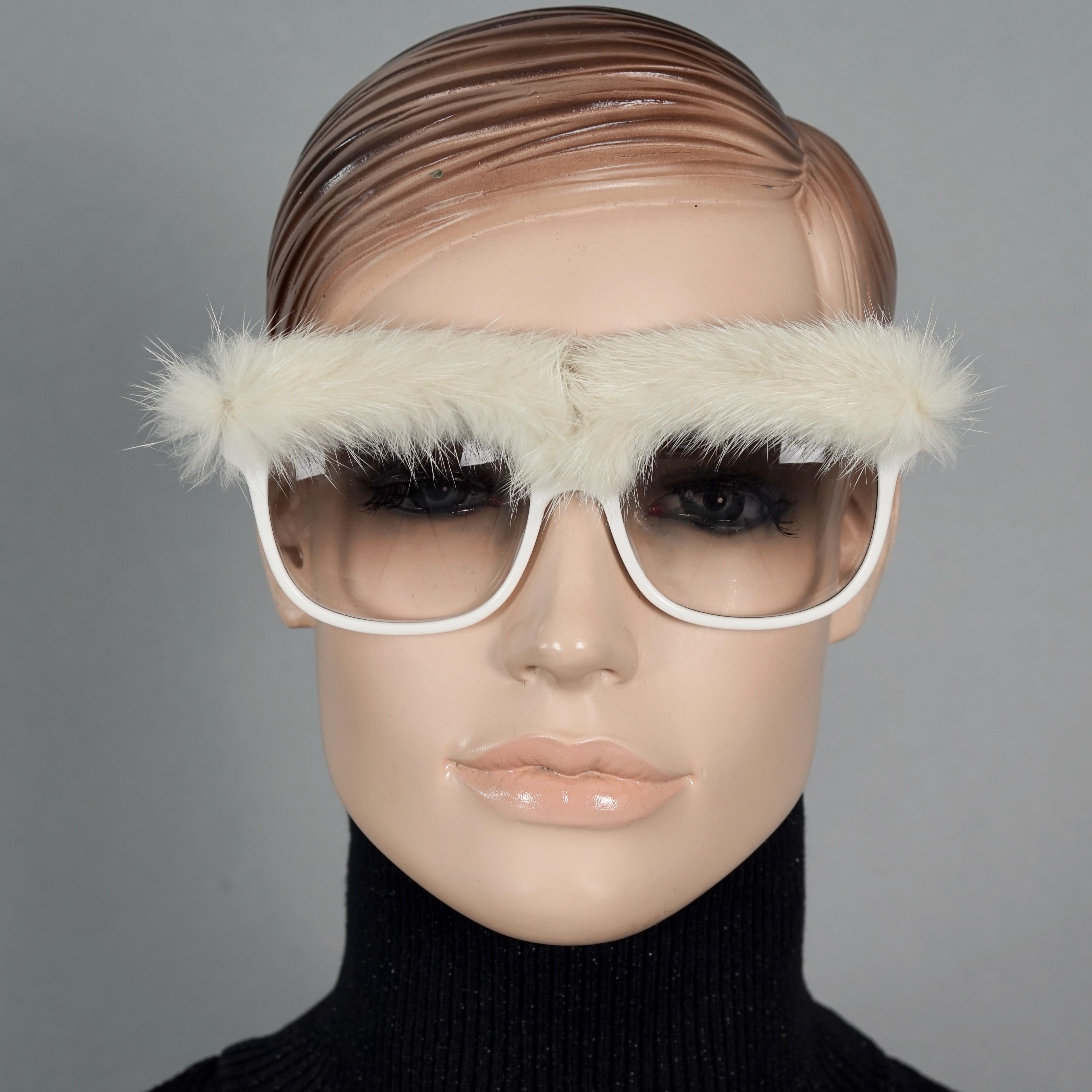 Vintage EMMANUELLE KHANH PARIS Fur Brow Sunglasses

Measurements:
Vertical Height: 2.75 inches (7 cm)
Horizontal Width: 5.90 inches  (15 cm)
Temple Length: 5.35 inches  (13.6 cm)

Features:
- 100% Authentic EMMANUELLE KHANH. 
- Dramatic fur brow top