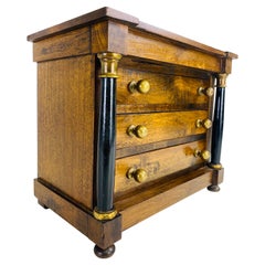 Vintage empire style jewelry or trinkets chest of drawers.