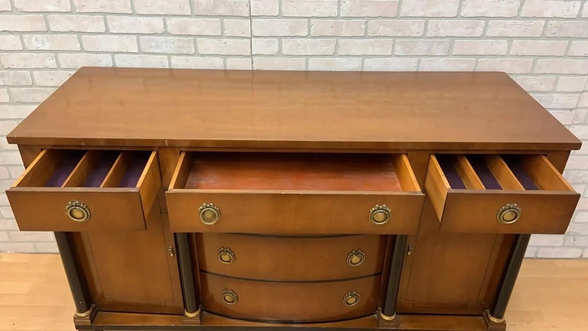 Vintage Empire Style Sideboard/Credenza Storage with Black and Gold Columns

This vintage inlaid sideboard with black and gold columns exudes elegance and sophistication with its intricate inlaid design and striking black and gold columns. The