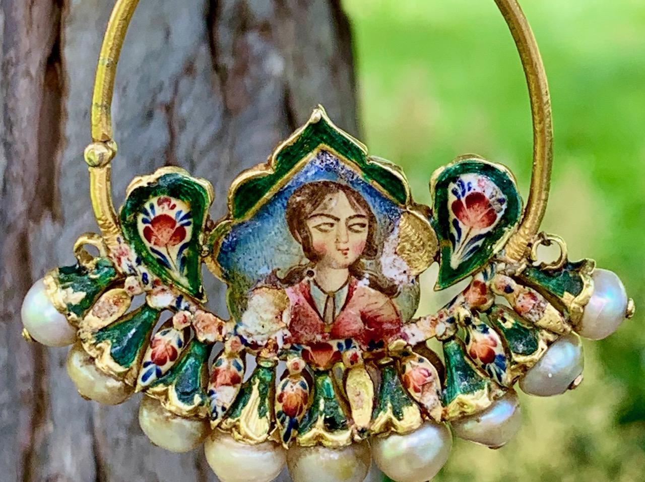 This necklace and pendant are exquisite.  We don't really know how to describe it. We believe there must be some symbolism or significance; or perhaps it is part of a traditional costume.   It is enameled it several areas.  The golden ring has nine