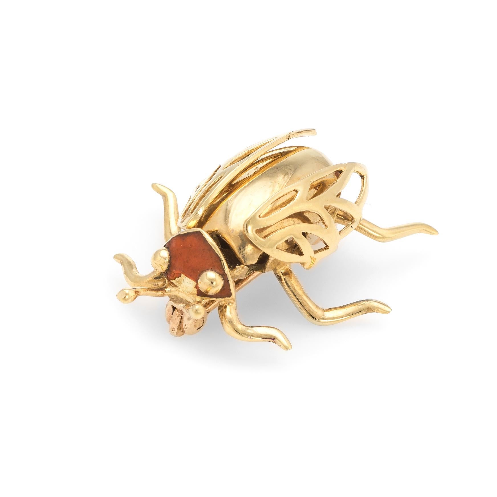 Finely detailed vintage beetle bug brooch, crafted in 14 karat yellow gold.

The bug features movable golden wings.

The head is set with orange enamel. Note: chip to enamel.

The brooch is in good condition.

Particulars:

Weight: 5.2