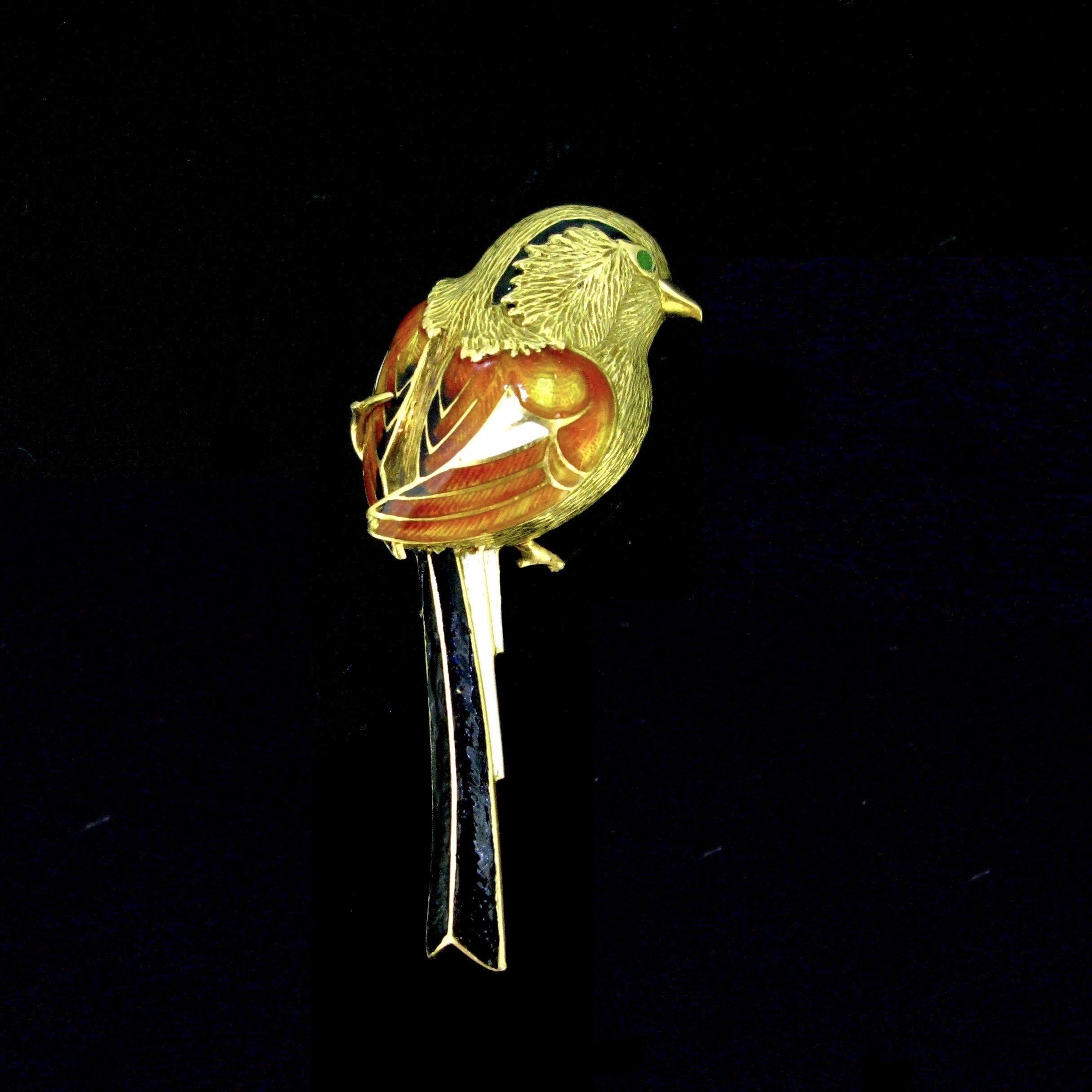 Weight: 14.15gr

Metal: 18kt yellow gold
Enamel

Condition: Very Good
(repairs on the enamel)

Hallmarks: French, eagle’s head

Comments: This lovely brooch features a realistic bird on a branch. The eye is adorned with a green stone and the