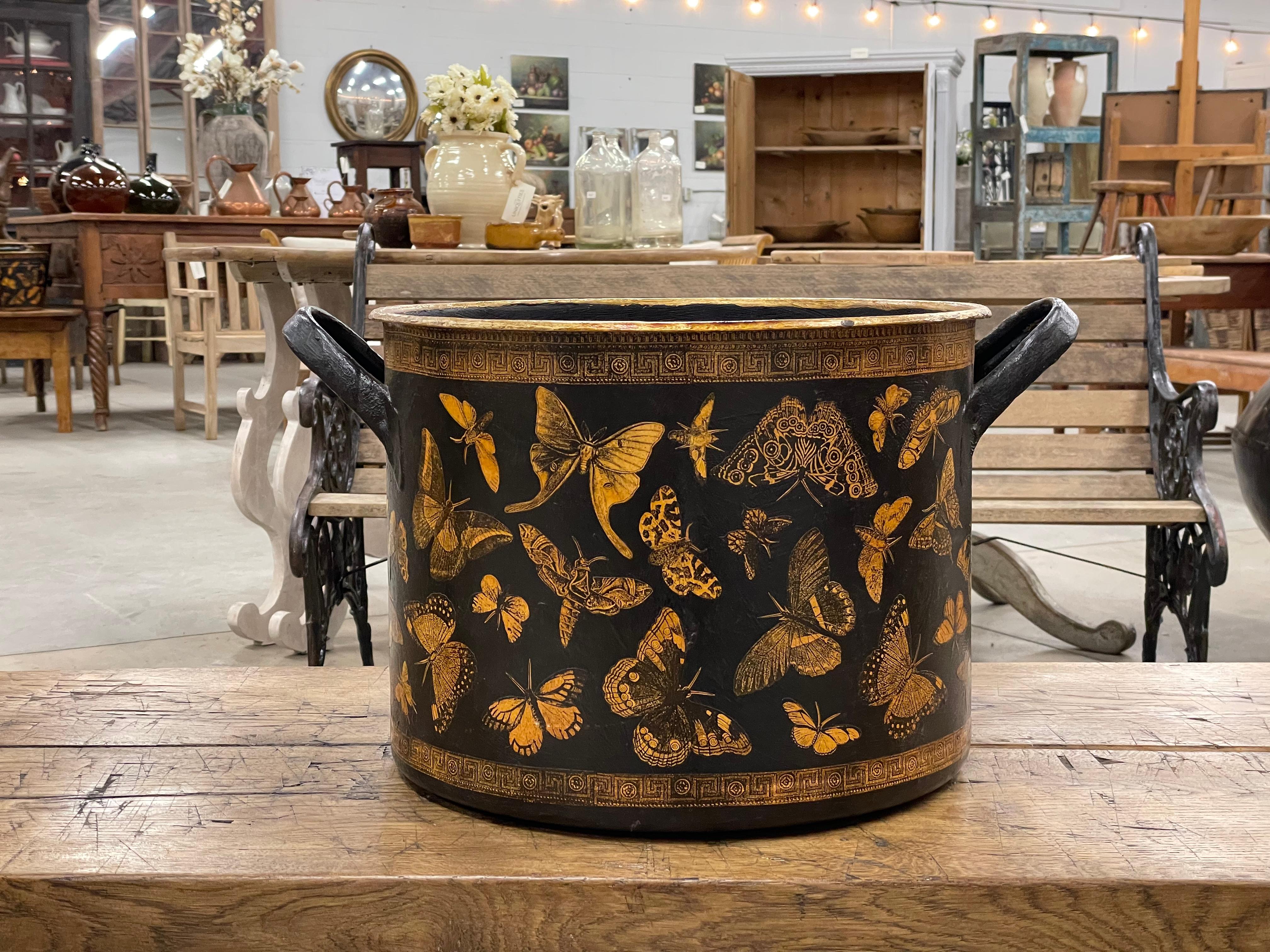 Large vintage enamel metal pot painted and recently découpaged with Victorian style illustrations of butterflies.

The beautiful and meticulous art of découpage can be traced back to the nomadic tribes of Siberia, who cut out felt and decorated the